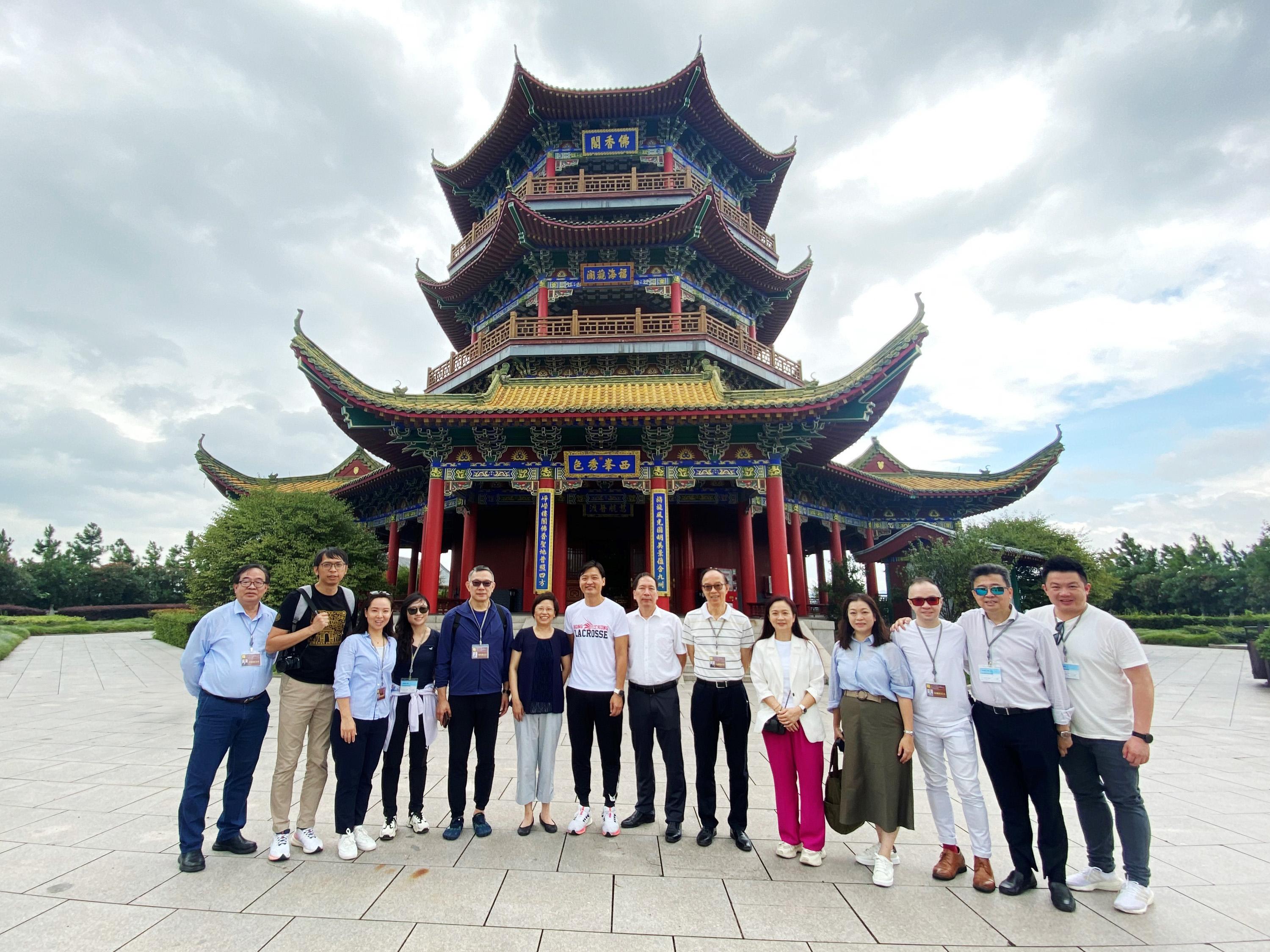 The delegation of the Legislative Council (LegCo) Panel on Home Affairs, Culture and Sports concluded its duty visit to Hangzhou and Dongyang today (August 3). Photo shows the delegation taking a group photo at the New Yuanmingyuan in Hengdian World Studios in Dongyang.