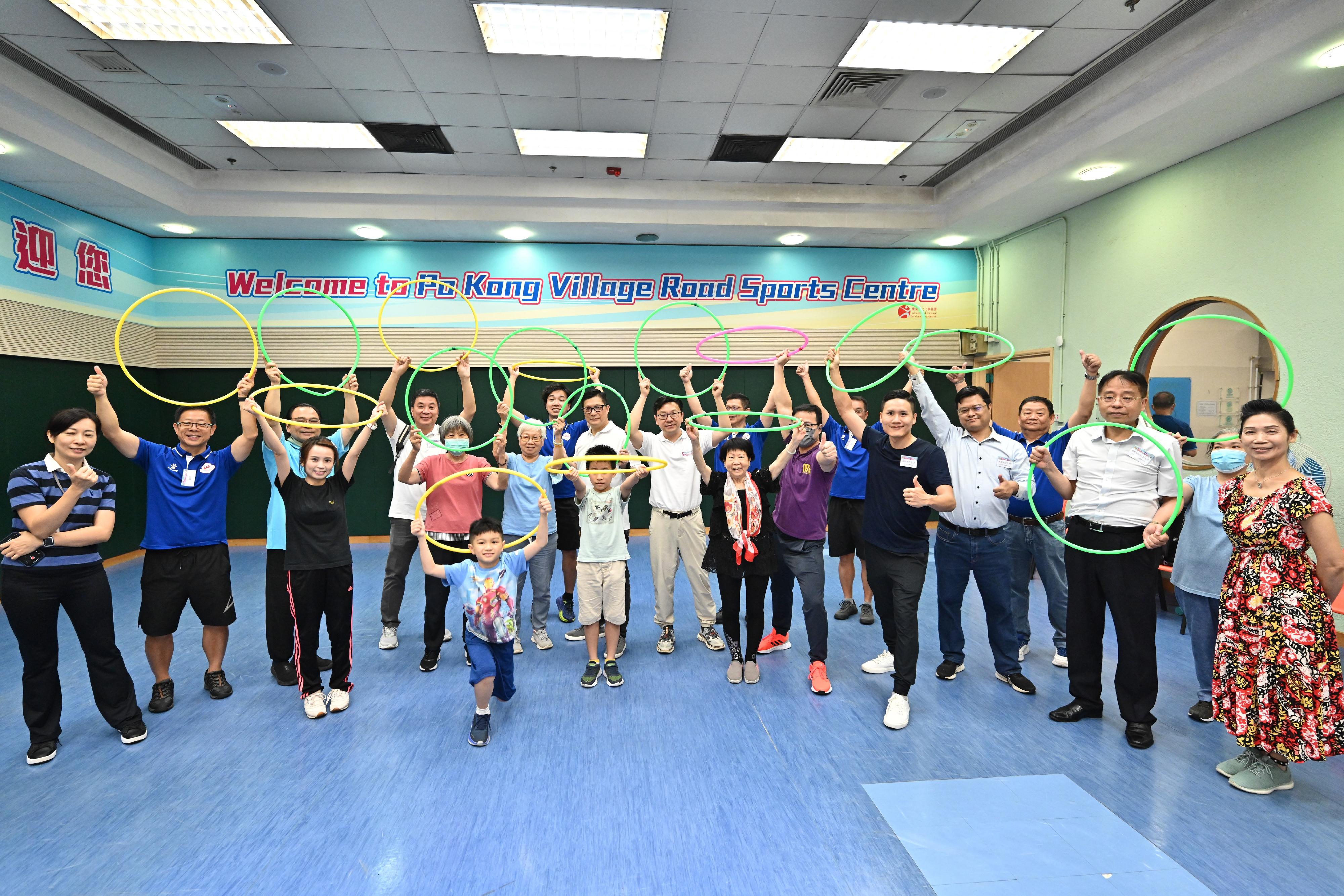 The Secretary for Security, Mr Tang Ping-keung, and the Secretary for Labour and Welfare, Mr Chris Sun, joined the public for sports and recreation programmes at Po Kong Village Road Sports Centre this afternoon (August 6) as part of the Sport For All Day 2023 organised by the Leisure and Cultural Services Department. Photo shows Mr Tang (fourth left, second row) and Mr Sun (fifth left, second row) with participants of Hula Hoop Fitness Exercises.
 