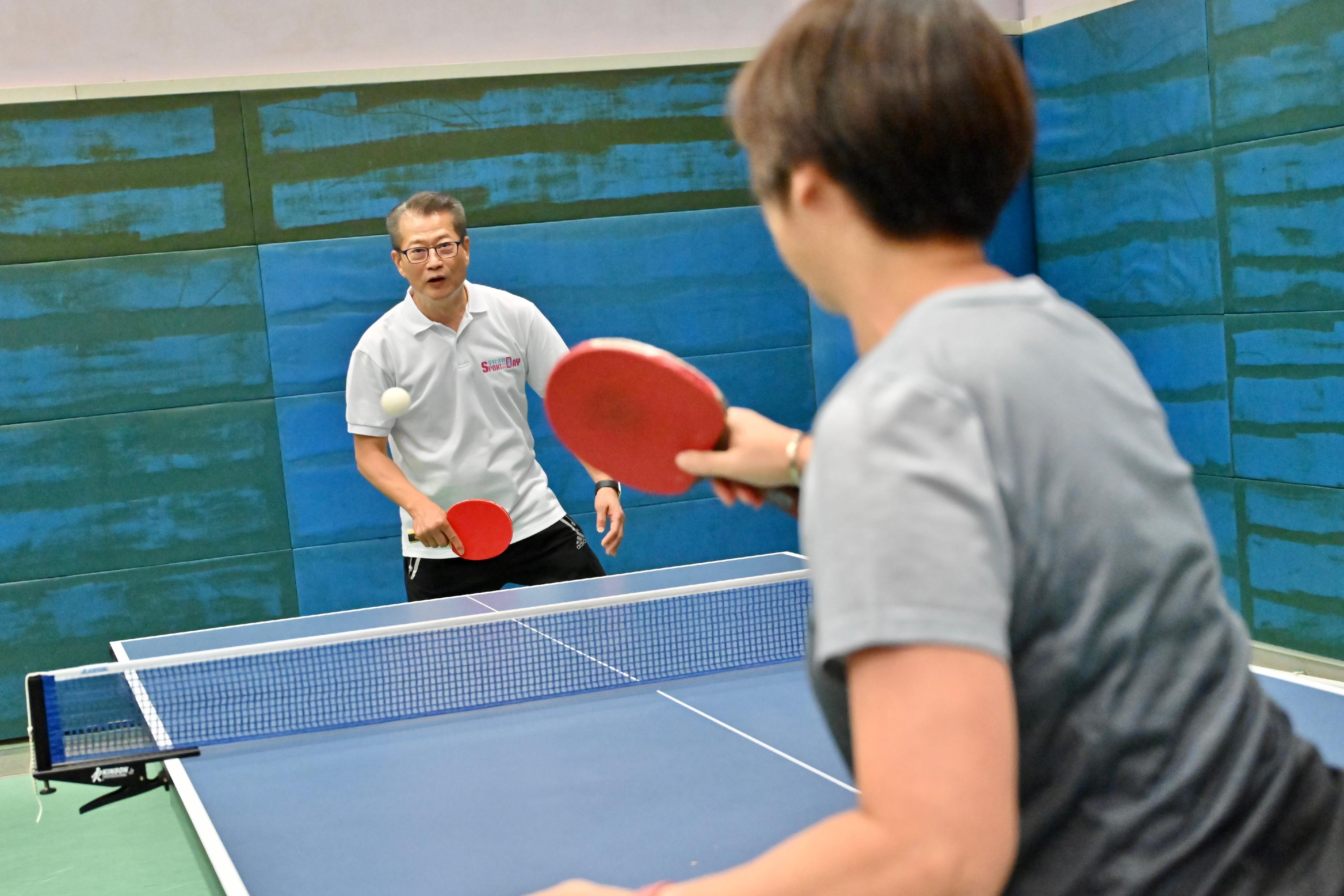 The Financial Secretary, Mr Paul Chan, participated in the Sport For All Day 2023 organised by the Leisure and Cultural Services Department at Island East Sports Centre today (August 6). Photo shows Mr Chan (left) in a table tennis play-in session with a member of public.