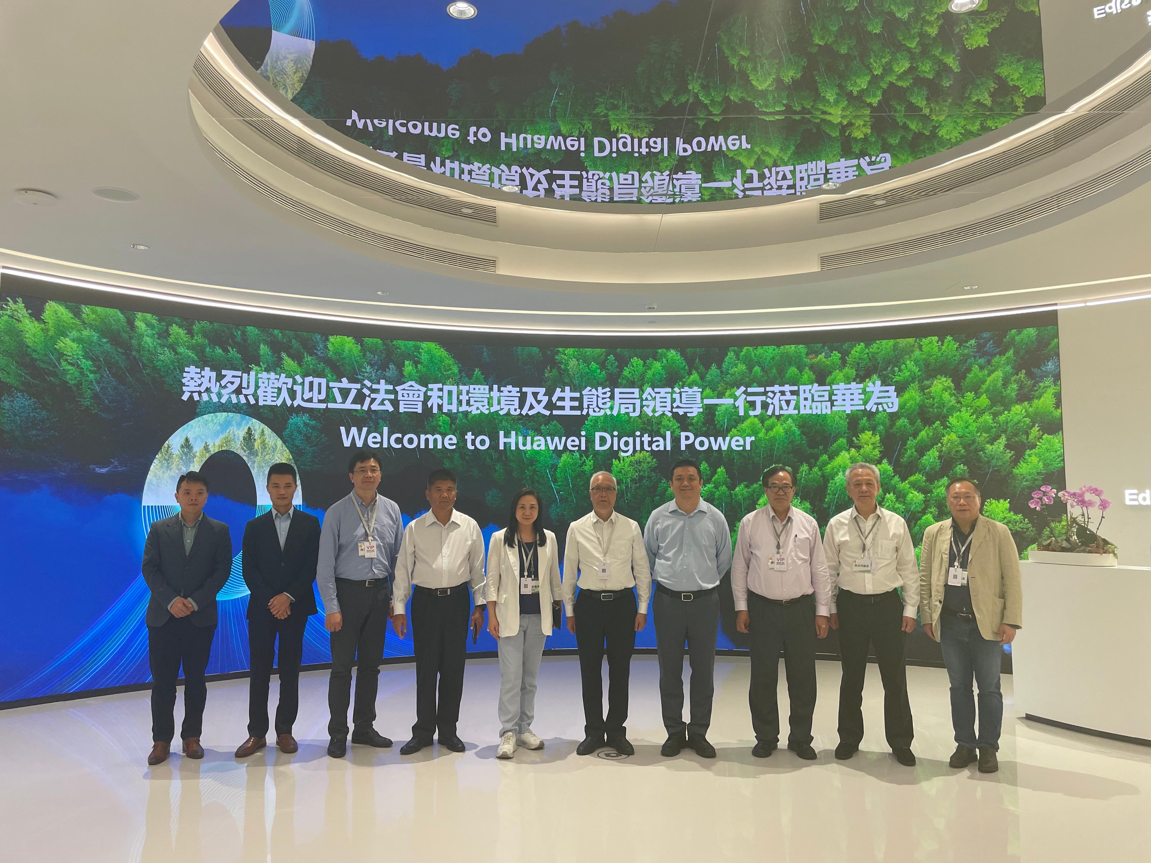 The Secretary for Environment and Ecology, Mr Tse Chin-wan, together with the Legislative Council Panel on Environmental Affairs, today (August 8) visited the exhibition hall of Huawei Digital Power AntoHill Headquarters in Shenzhen in the afternoon. Photo shows Mr Tse (fifth right) with the delegation of the Legislative Council Panel on Environmental Affairs and representatives of Huawei. 
