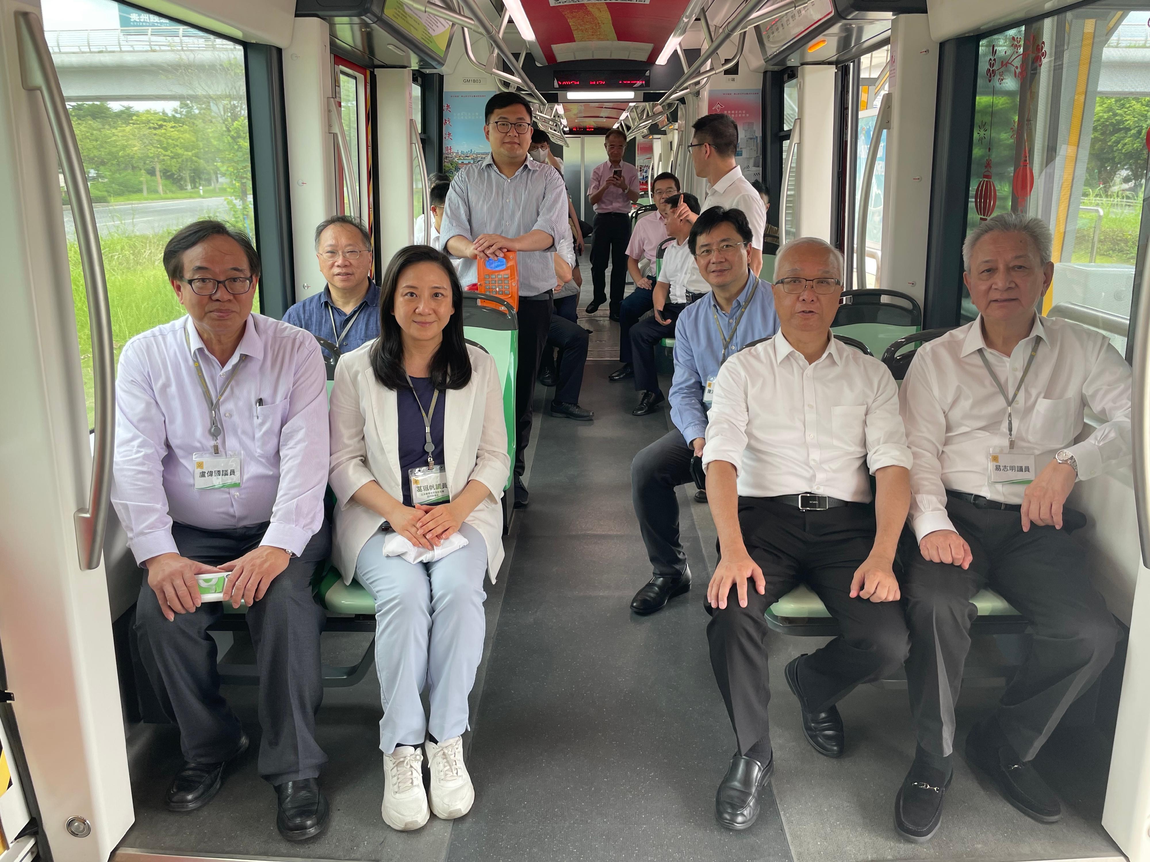 The Secretary for Environment and Ecology, Mr Tse Chin-wan, together with the Legislative Council Panel on Environmental Affairs, today (August 8) visited Foshan, which is the pioneer demonstration area for the development of the hydrogen energy industry in Guangdong Province, in the morning. Photo shows Mr Tse (second right) and the delegation of the Legislative Council Panel on Environmental Affairs, riding on a hydrogen-fuelled light rail vehicle.