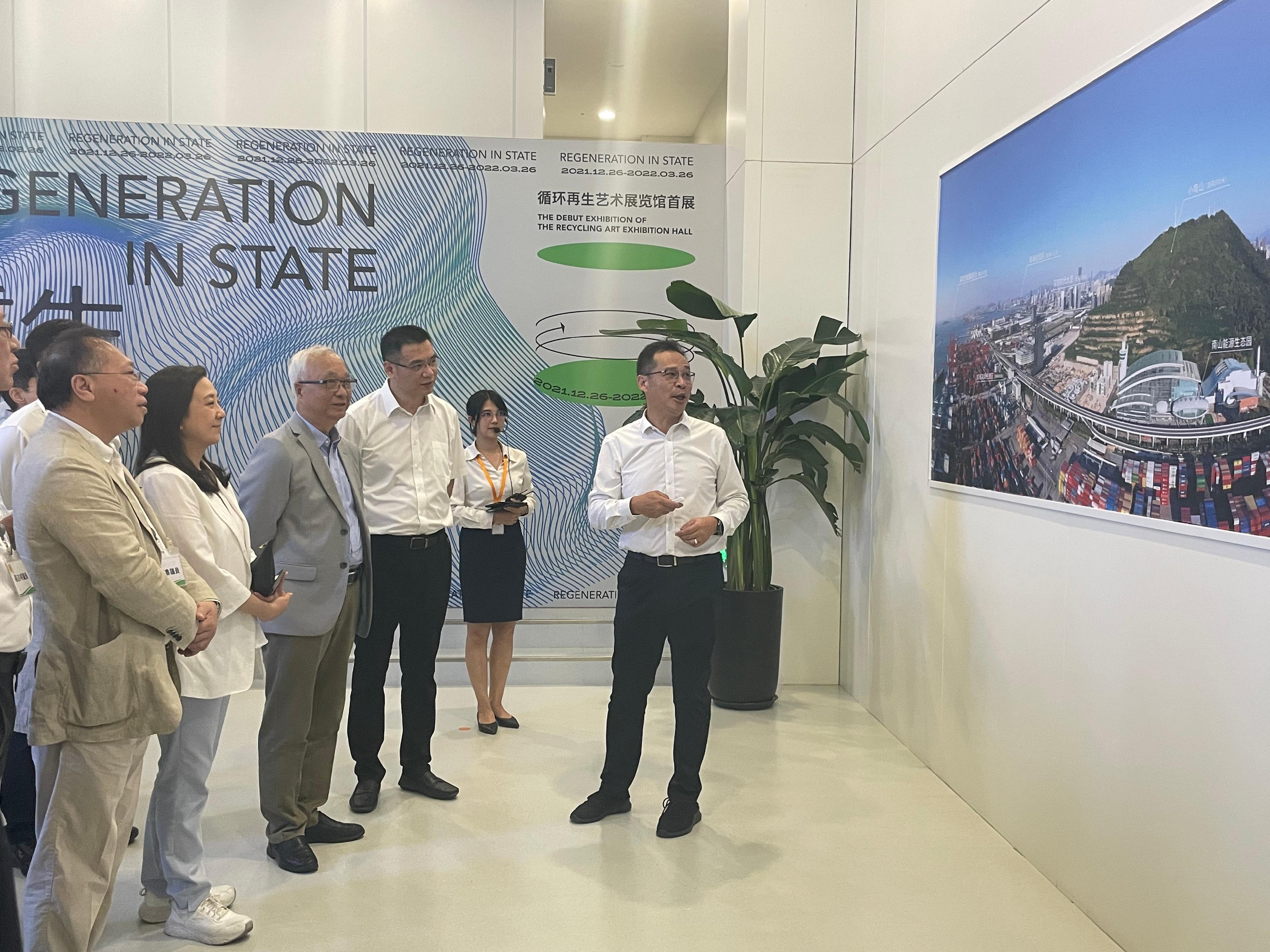 The Secretary for Environment and Ecology, Mr Tse Chin-wan, together with the Legislative Council Panel on Environmental Affairs, today (August 9) visited the Nanshan Energy Eco-Park in Shenzhen in the afternoon. Photo shows Mr Tse (fourth right), and the delegation of the Legislative Council Panel on Environmental Affairs, receiving a briefing from a representative on the operation of the Park.