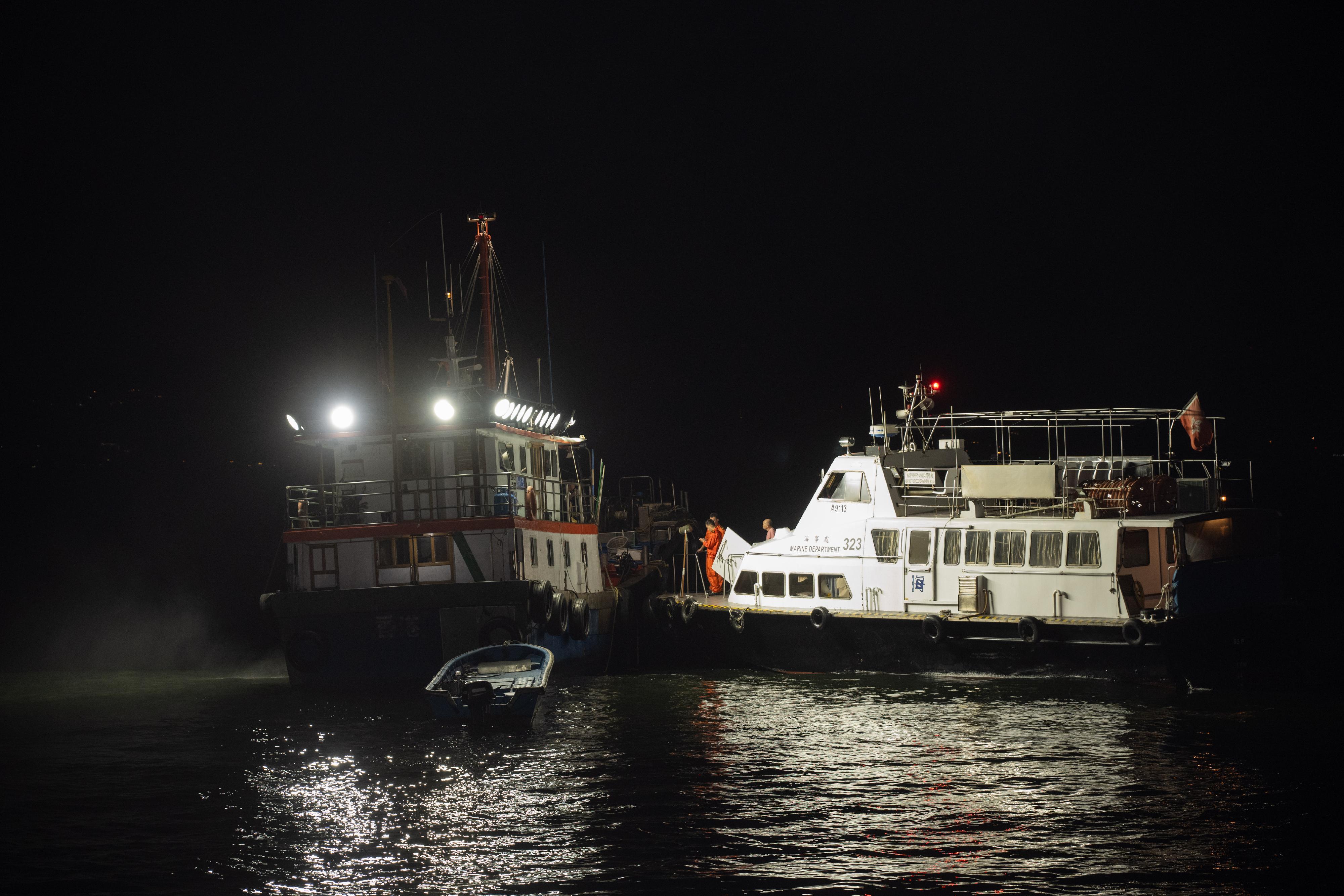 The Marine Department (MD) together with the Hong Kong Police Force and the Agriculture, Fisheries and Conservation Department conducted a joint operation against the improper use of bright light for fishing and illegal fishing activities in the southern waters of Hong Kong last night (August 10). Photo shows MD officers about to inspect a fishing vessel.