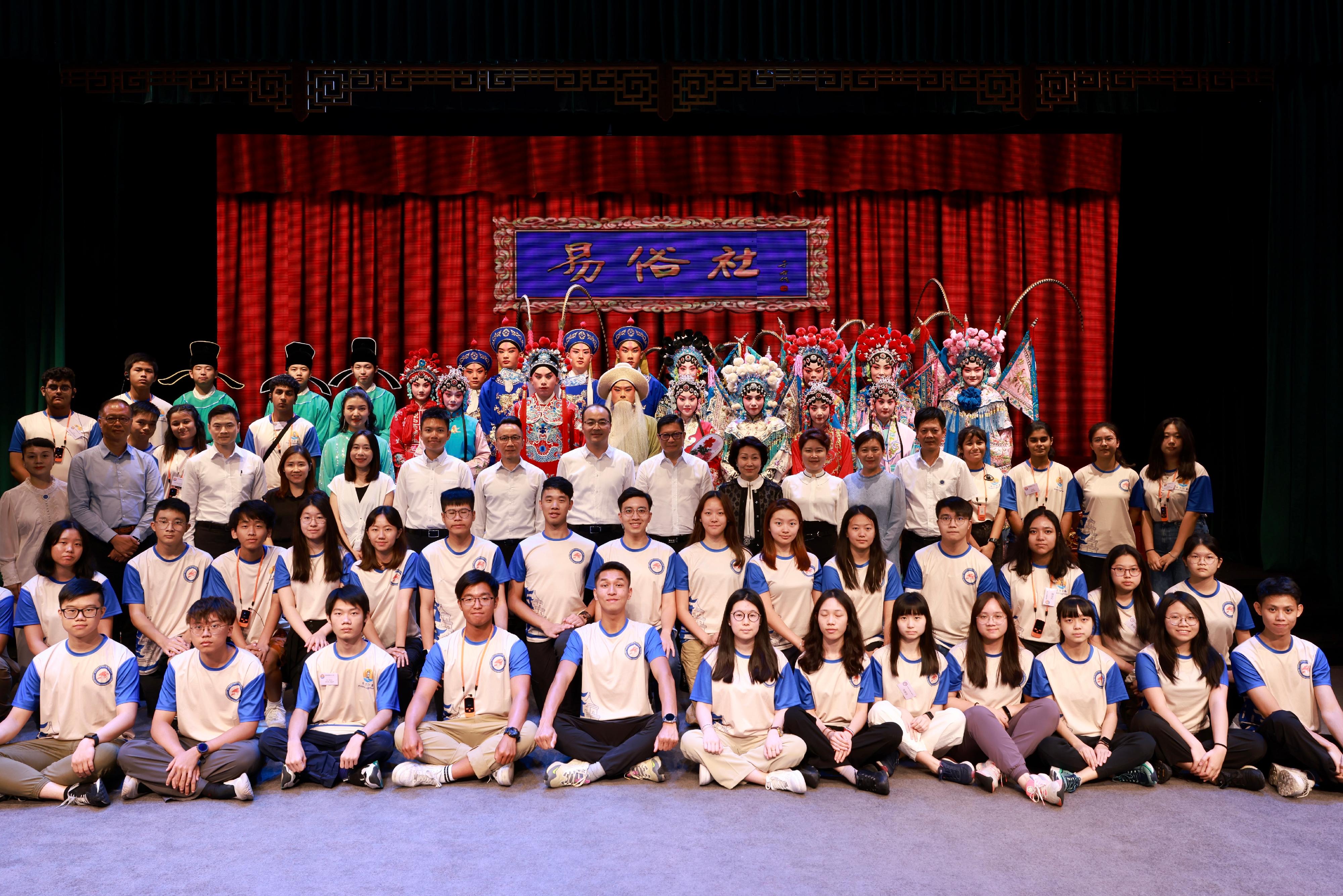 The Secretary for Security, Mr Tang Ping-keung, led members of the Security Bureau Youth Uniformed Group Leaders Forum and non-Chinese speaking students of Project Lighthouse to visit Shaanxi and Beijing. Photo shows Mr Tang (third row, centre) and the youth groups' members with performers after watching Qinqiang performance in the Yisushe Theater cultural block on August 16.