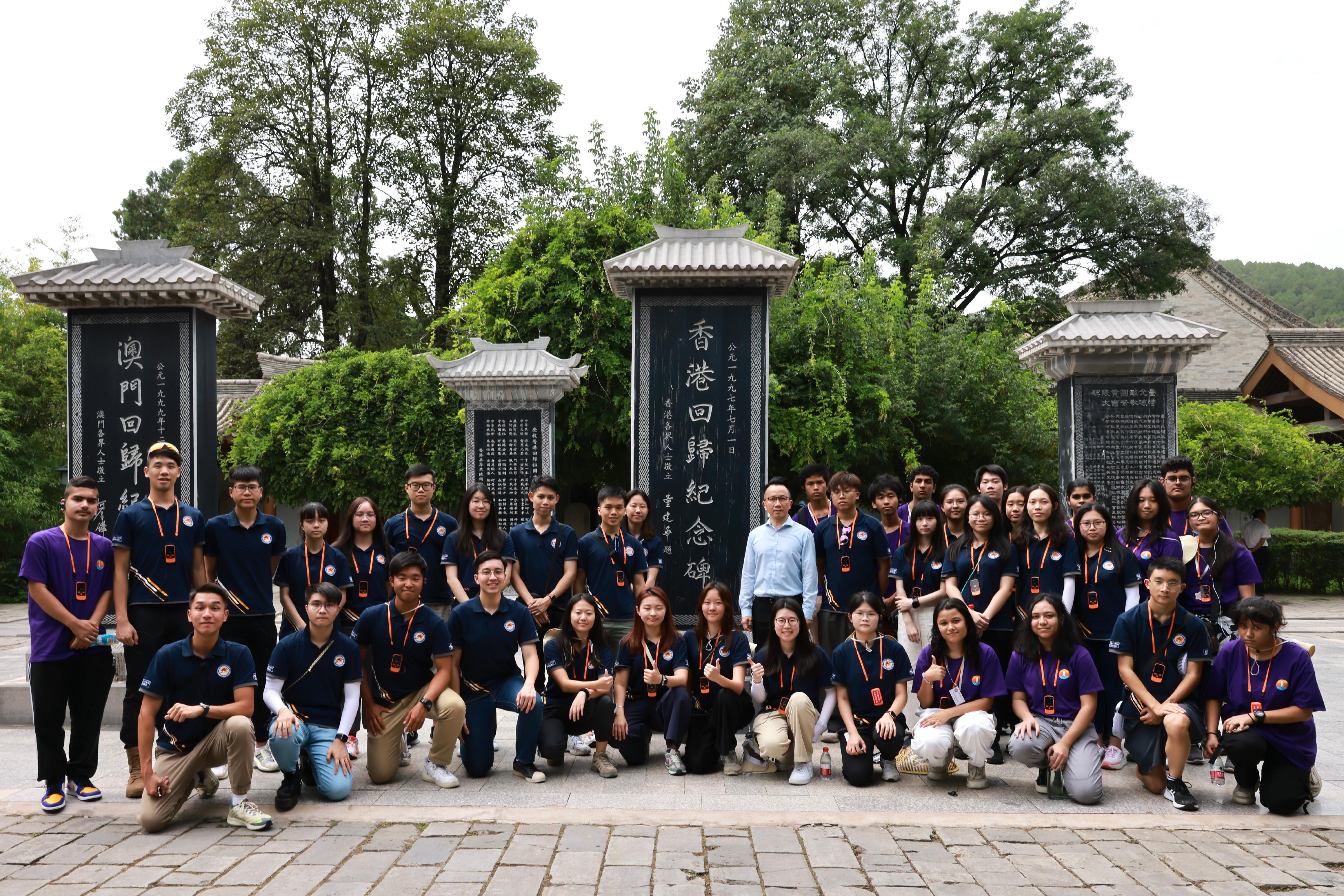 The Security Bureau youth groups' study tour to Shaanxi and Beijing begins its visit to Yan'an. Photo shows the Permanent Secretary for Security, Mr Patrick Li (second row, 11th left), with the youth members at the reunification monument of the Mausoleum of Yellow Emperor on August 17.