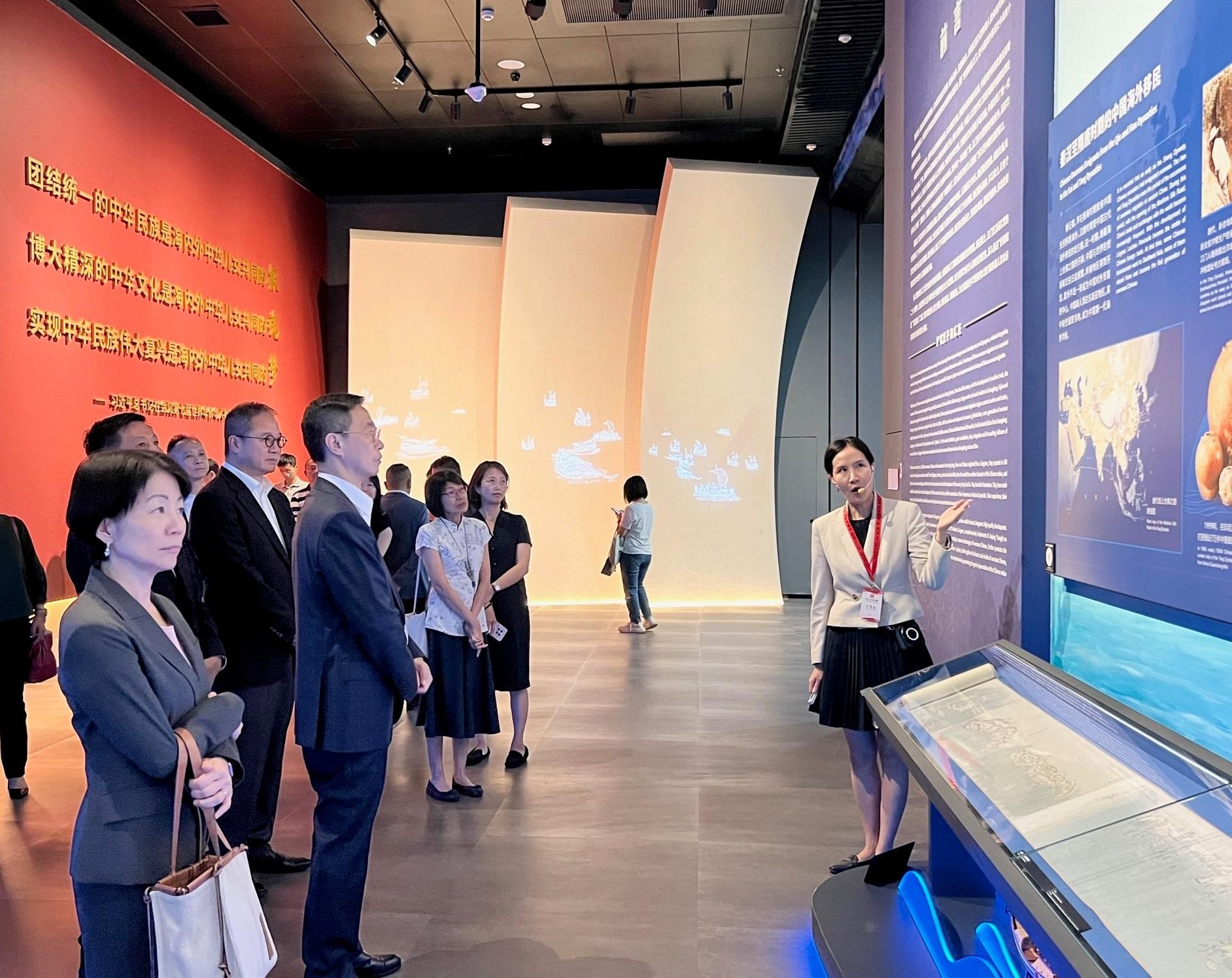 Accompanied by the Permanent Secretary for Culture, Sports and Tourism, Mr Joe Wong (second left), and the Commissioner for Tourism, Ms Vivian Sum (first left), the Secretary for Culture, Sports and Tourism, Mr Kevin Yeung (third left), visits the Jiangmen Wuyi Museum of Overseas Chinese in Jiangmen yesterday (August 16) to learn about the contributions of overseas Chinese to the development of the world.