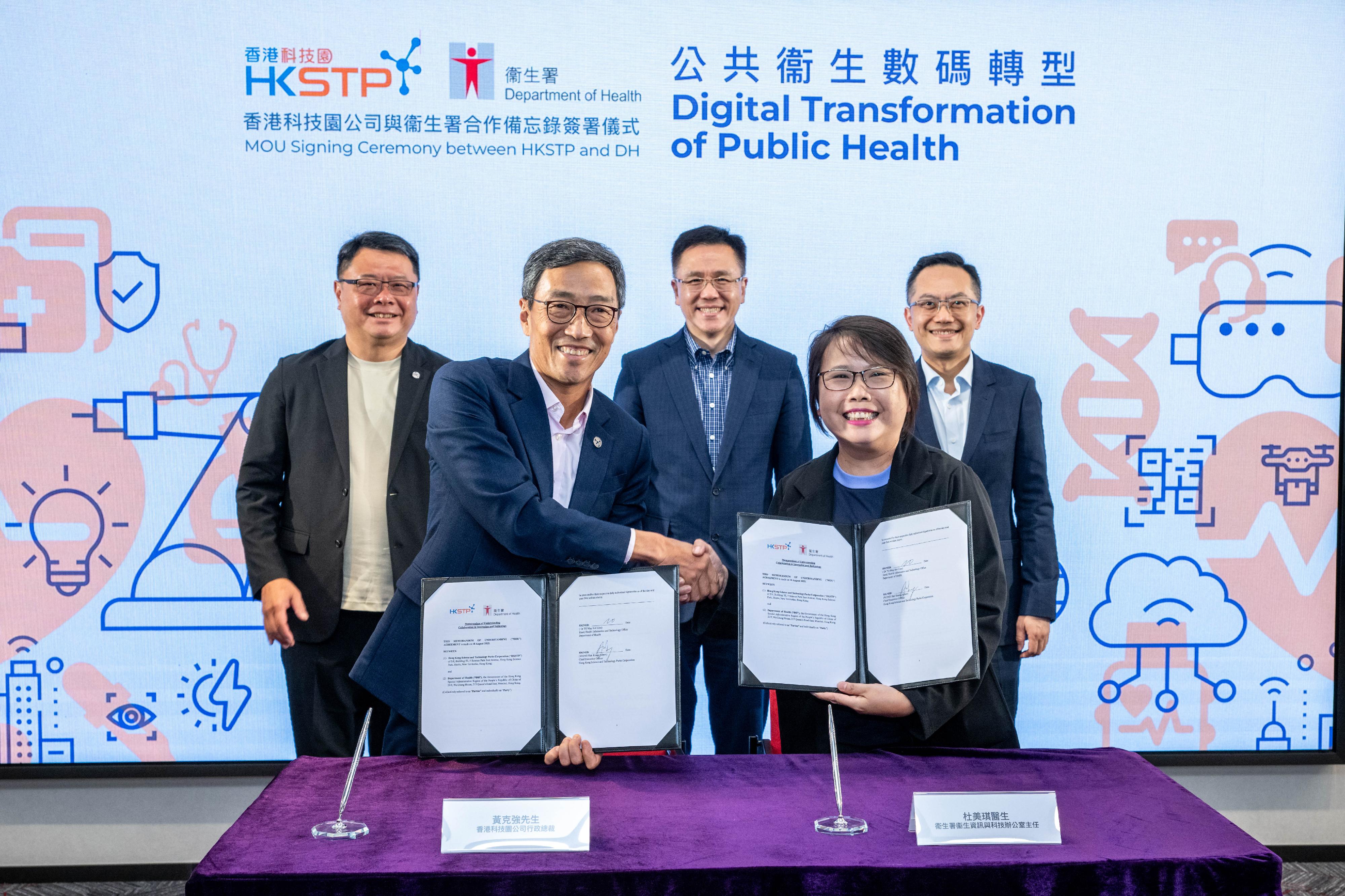 The Department of Health (DH) and the Hong Kong Science and Technology Parks Corporation (HKSTP) signed a Memorandum of Understanding (MOU) today (August 18) which aims at leveraging the latest innovation and technology to expedite digitalisation for public health functions while fostering an innovation-driven culture in the healthcare sector. Witnessed by the Secretary for Innovation, Technology and Industry, Professor Sun Dong (back row, centre); the Director of Health, Dr Ronald Lam (back row, right); and the Chairman of the HKSTP, Dr Sunny Chai (back row, left), the MOU was signed by the Head, Health Informatics and Technology Office of the DH, Dr Liza To (front row, right), and the Chief Executive Officer of the HKSTP, Mr Albert Wong (front row, left).