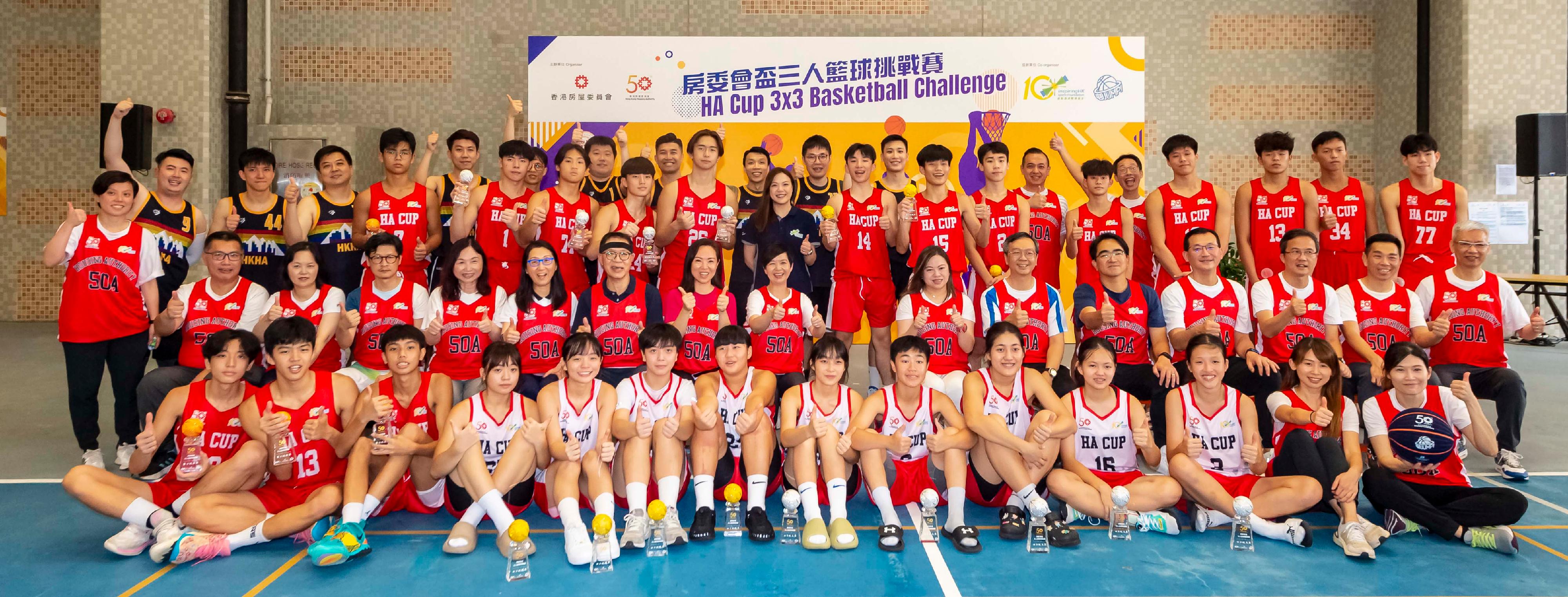 The final of the "HA Cup 3x3 Basketball Challenge", one of the Hong Kong Housing Authority's 50th anniversary celebrations, was held today (August 20). Photo shows the Secretary for Housing, Ms Winnie Ho (second row, eighth left); the Permanent Secretary for Housing, Miss Rosanna Law (second row, ninth left); Under Secretary for Housing, Mr Victor Tai (second row, tenth left) with Housing Authority members, guests and players.