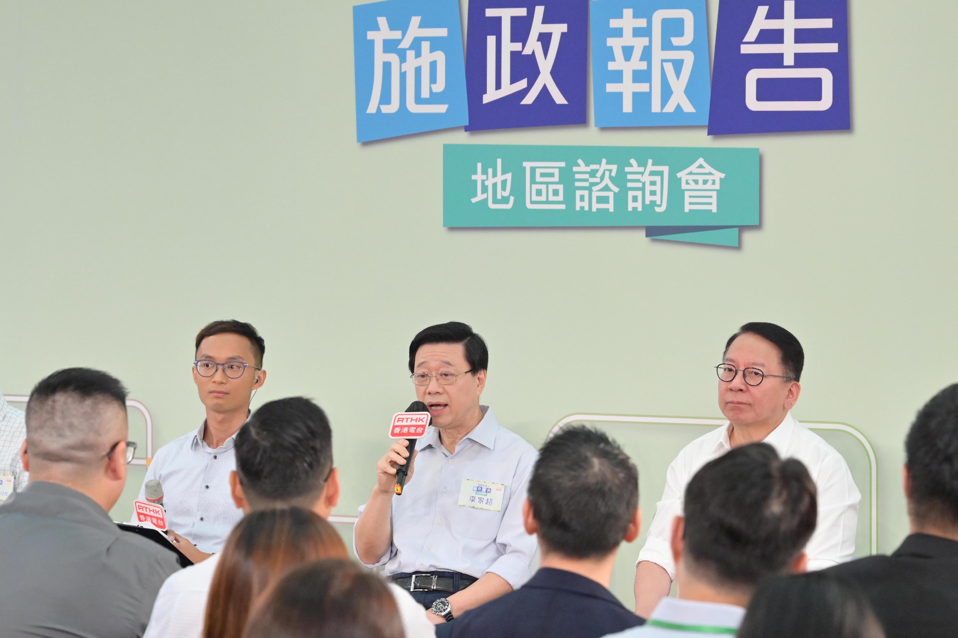 The Chief Executive, Mr John Lee, attended the 2023 Policy Address District Forum with some Principal Officials this morning (August 20) to listen to views and suggestions of local community members on the upcoming Policy Address. Photo shows Mr Lee (centre), and the Chief Secretary for Administration, Mr Chan Kwok-ki (right), listening to views of the public at the consultation session.
