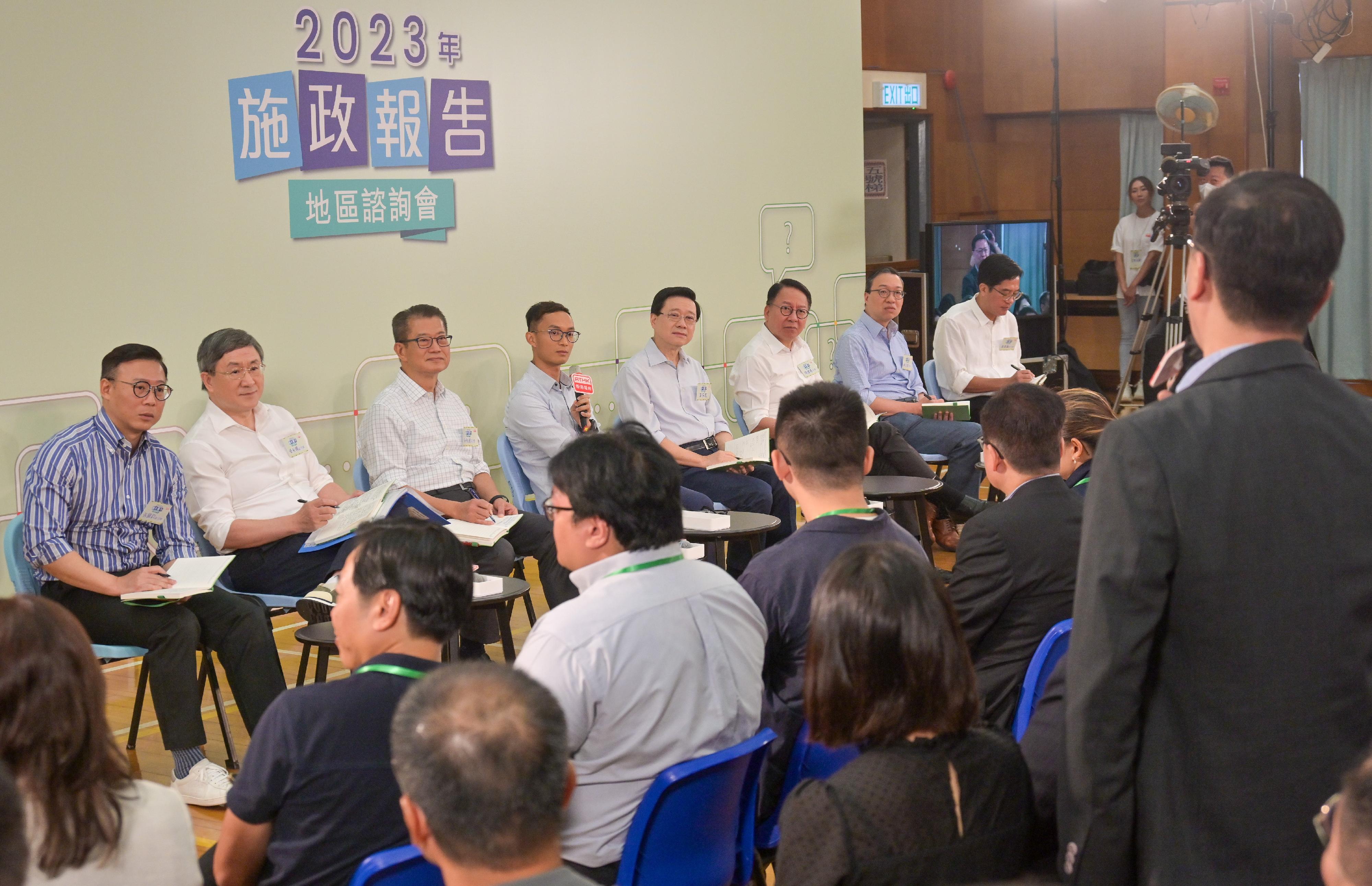 The Chief Executive, Mr John Lee, attended the 2023 Policy Address District Forum with some Principal Officials this morning (August 20) to listen to views and suggestions of local community members on the upcoming Policy Address. Photo shows Mr Lee (fourth right); the Chief Secretary for Administration, Mr Chan Kwok-ki (third right); the Financial Secretary, Mr Paul Chan (third left); the Secretary for Justice, Mr Paul Lam, SC (second right); the Deputy Chief Secretary for Administration, Mr Cheuk Wing-hing (second left); the Deputy Financial Secretary, Mr Michael Wong (first right); and the Deputy Secretary for Justice, Mr Cheung Kwok-kwan (first left), listening to views of the public at the consultation session.