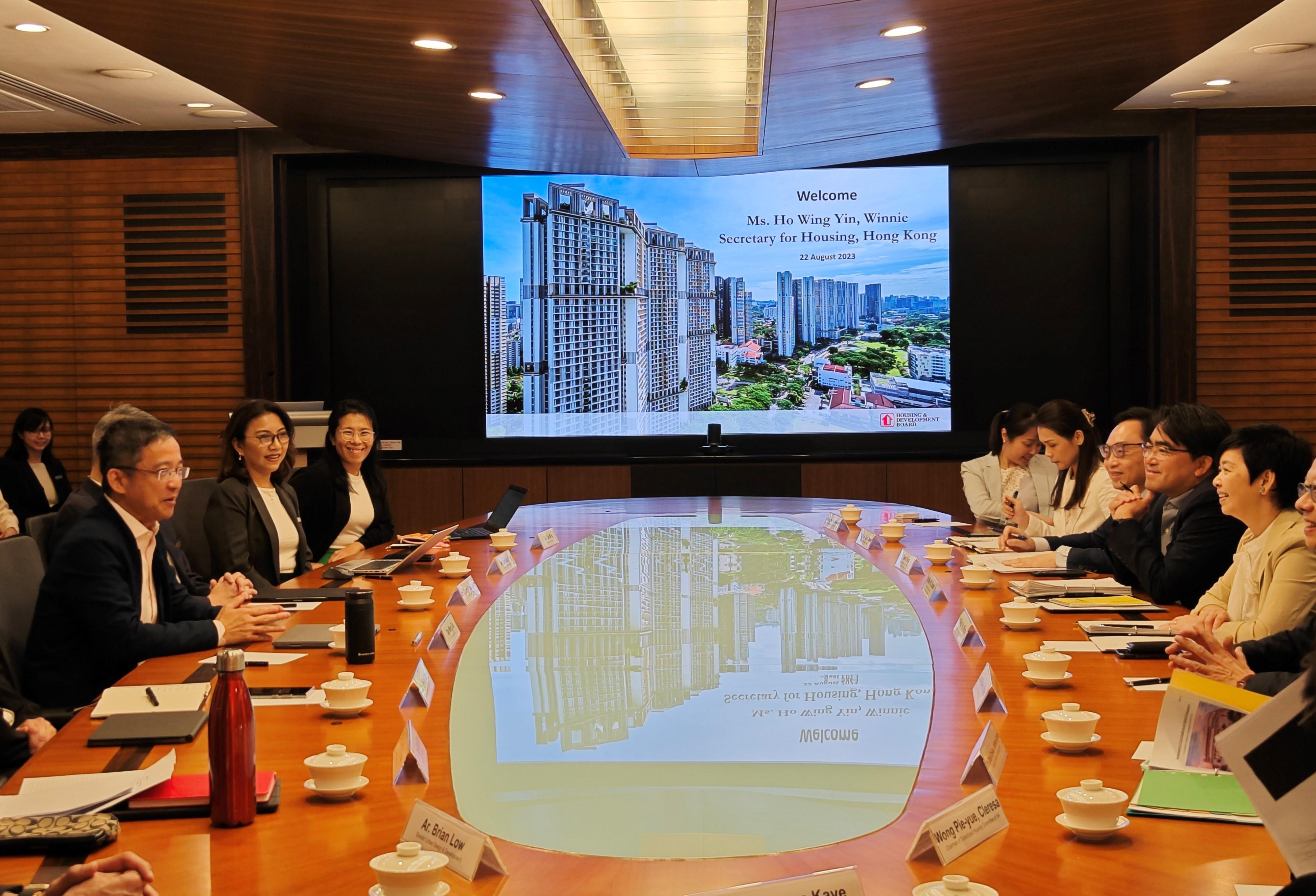 The Secretary for Housing, Ms Winnie Ho, began her visit to Singapore yesterday (August 22). She met with local government officials to exchange views in areas such as housing policies, innovative construction technologies and green building. Photo shows Ms Ho (first right) meeting with officials of the Housing & Development Board yesterday.