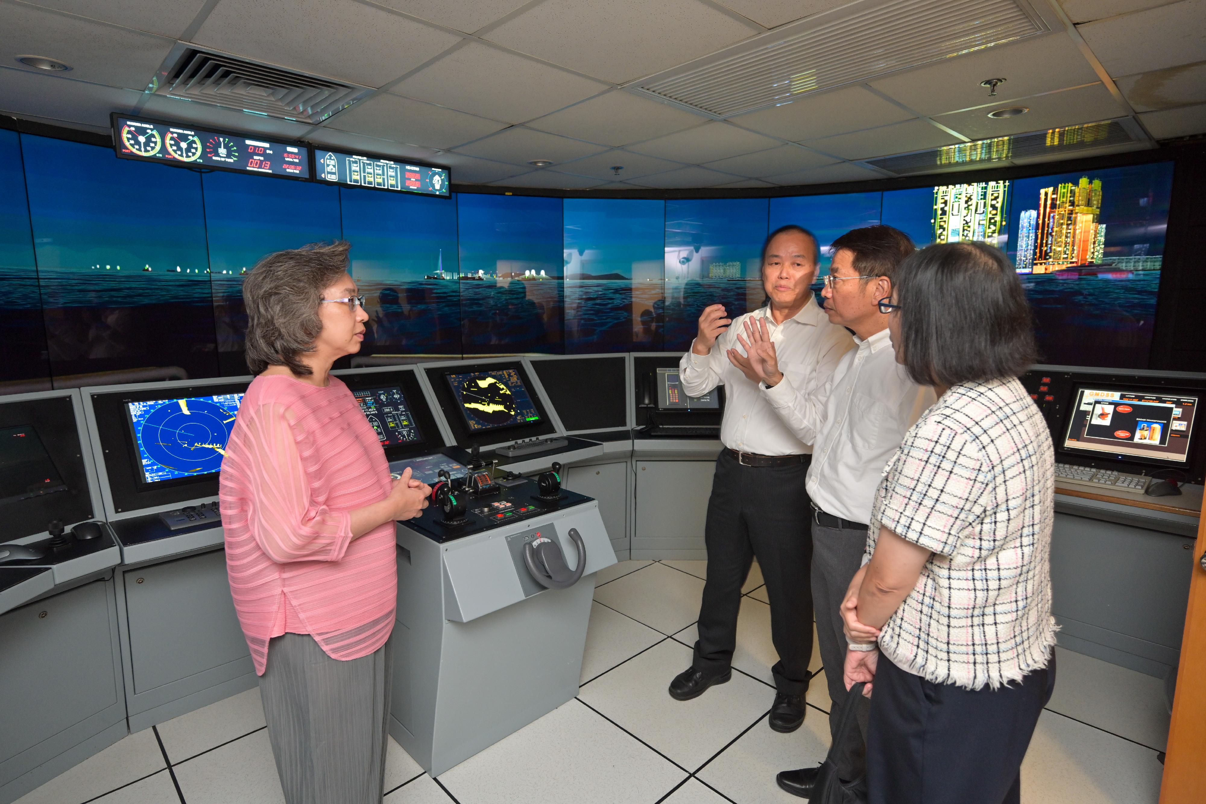 The Secretary for the Civil Service, Mrs Ingrid Yeung, visited the Marine Department today (August 24). Photo shows Mrs Yeung (first left) being briefed on the full mission ship simulator by the Assistant Director of Marine (Port Control), Mr Lai Chi-tung (second left), at the Marine Department Training Centre. Looking on are the Permanent Secretary for the Civil Service, Mr Clement Leung (second right), and the Director of Marine, Ms Carol Yuen (first right).
