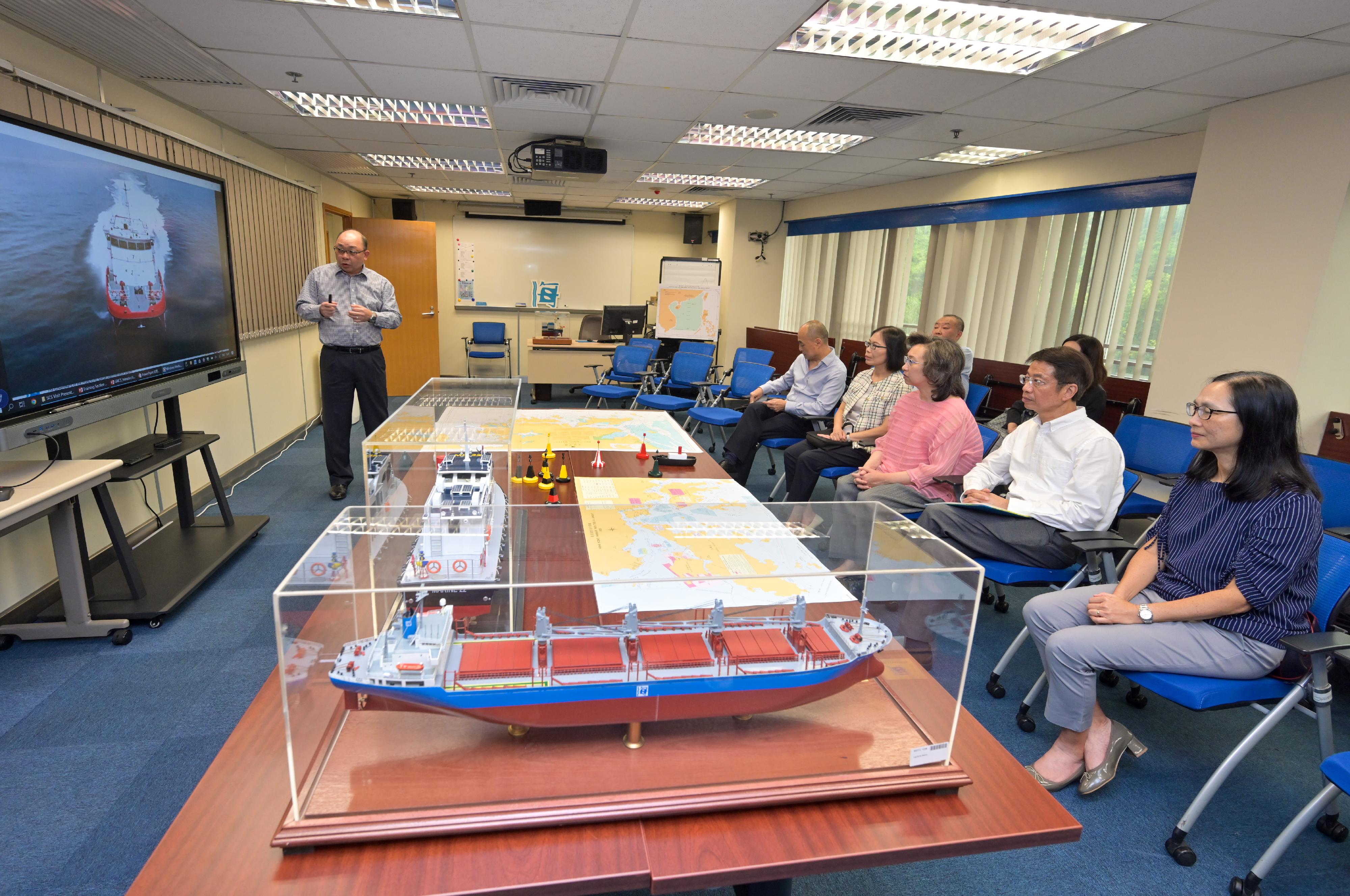 The Secretary for the Civil Service, Mrs Ingrid Yeung, visited the Marine Department today (August 24). Photo shows Mrs Yeung (third right) visiting the Marine Department Training Centre and being briefed by a duty officer on the marine training provided to the department's staff. Looking on are the Permanent Secretary for the Civil Service, Mr Clement Leung (second right), and the Director of Marine, Ms Carol Yuen (fourth right).