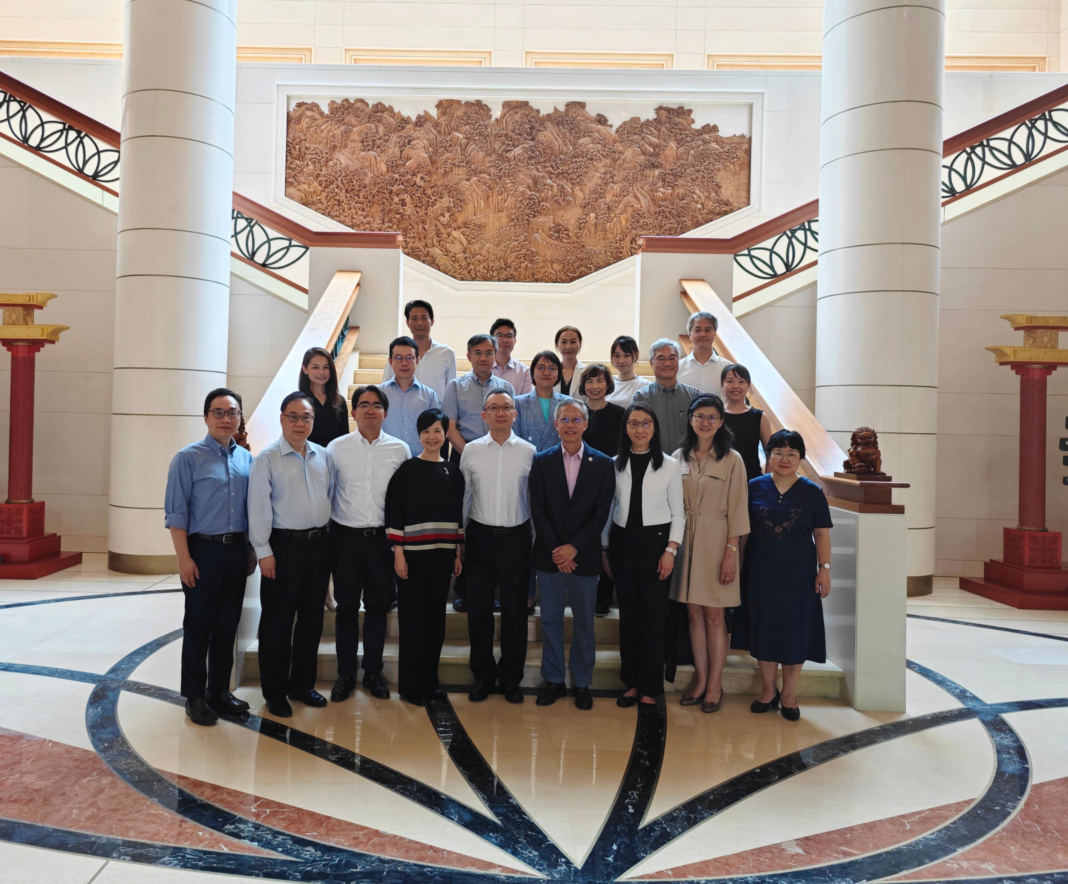 The Secretary for Housing, Ms Winnie Ho, was on the third day of her visit to Singapore yesterday (August 24). Ms Ho (first row, fourth left) and the Chargé d'Affaires of the Chinese Embassy in the Republic of Singapore, Mr Zhu Jing (first row, centre), are pictured with members of the delegation including members of the Hong Kong Housing Authority Strategic Planning Committee Dr Johnnie Chan (first row, second left), Ms Cleresa Wong (first row, third right), Ms Melissa Pang (first row, second right), Dr Billy Mak (second row, third left), Ms Serena Lau (second row, centre), Ms Cissy Chan (second row, third right); the Chairman of the Hong Kong Housing Society (HKHS), Mr Walter Chan (first row, fourth right); the Vice-Chairman of the HKHS, Professor Ling Kar-kan (second row, second right); and the Chief Executive Officer and Executive Director of the HKHS, Mr James Chan (second row, second left).