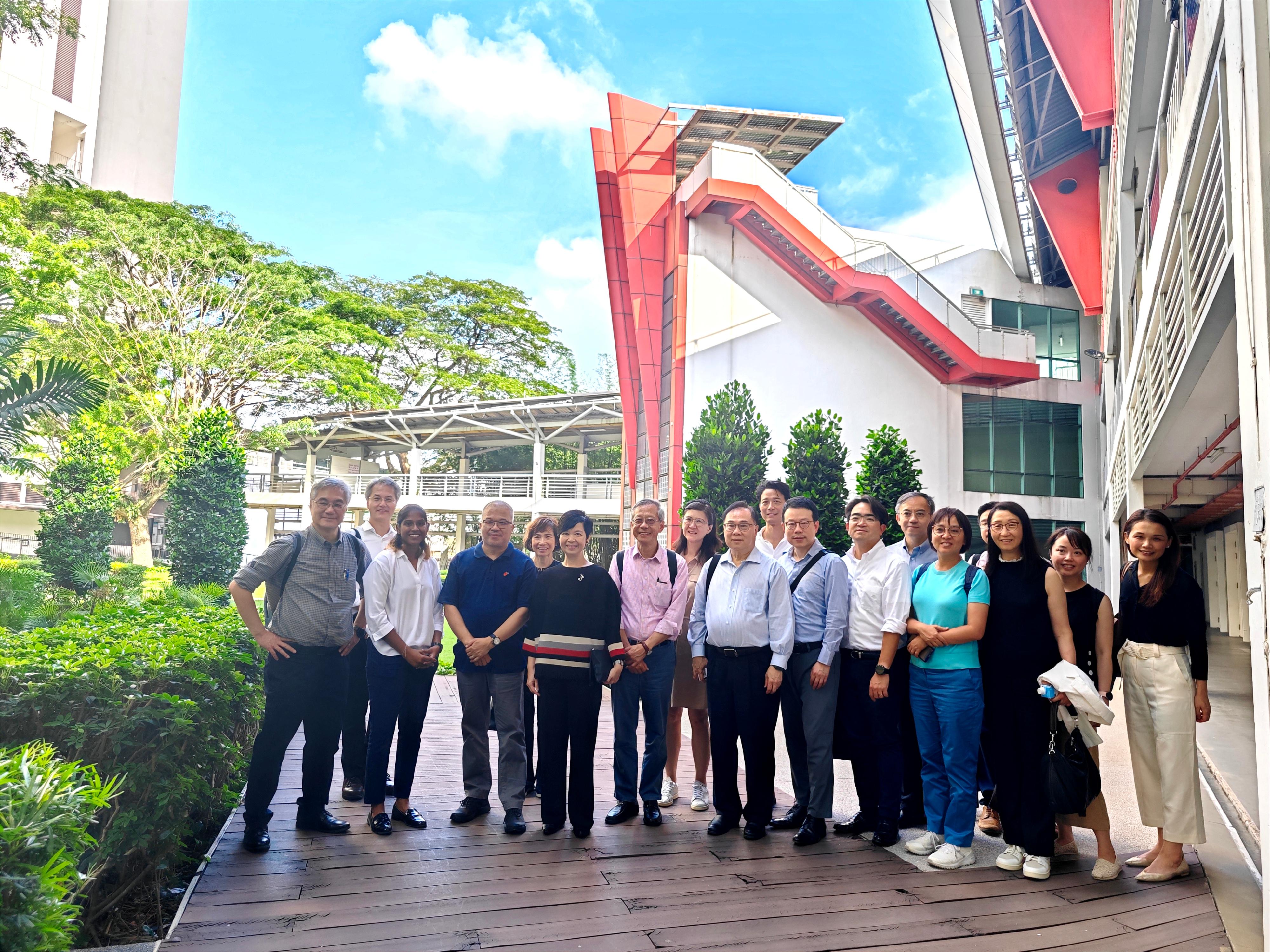 The Secretary for Housing, Ms Winnie Ho, was on the third day of her visit to Singapore yesterday (August 24). Photo shows Ms Ho (front row, fourth left) visiting the Building and Construction Authority yesterday.
 
