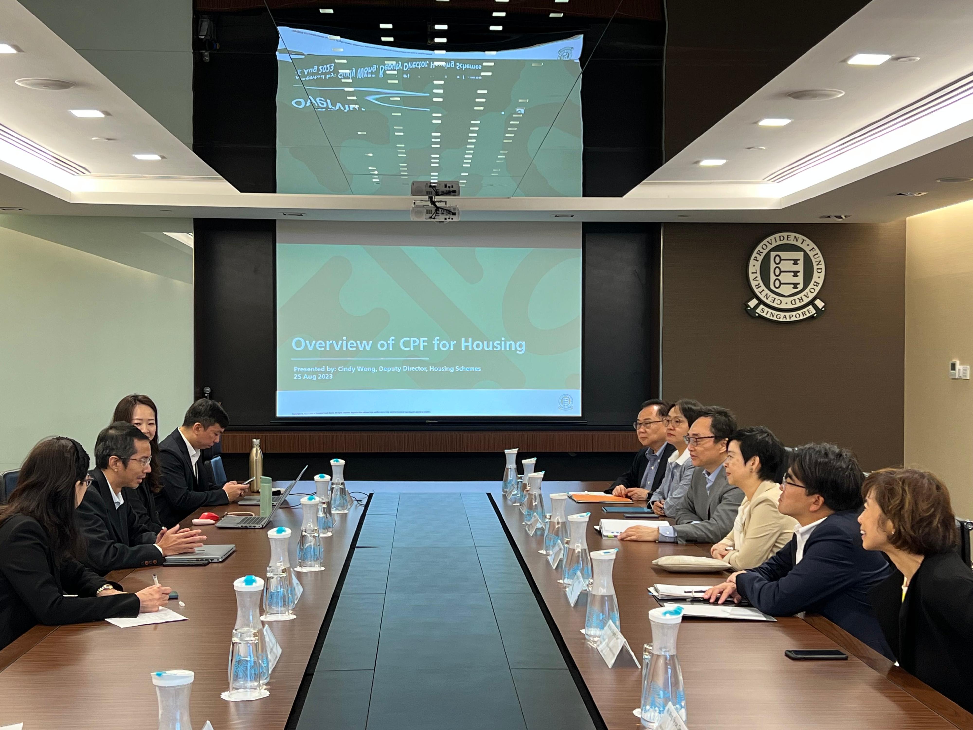 The Secretary for Housing, Ms Winnie Ho, was on the fourth day of her visit to Singapore today (August 25). Photo shows Ms Ho (third right) meeting with the Group Director of Policy, Statistics & Research of the Central Provident Fund Board, Mr Gregory Chia (second left), today.