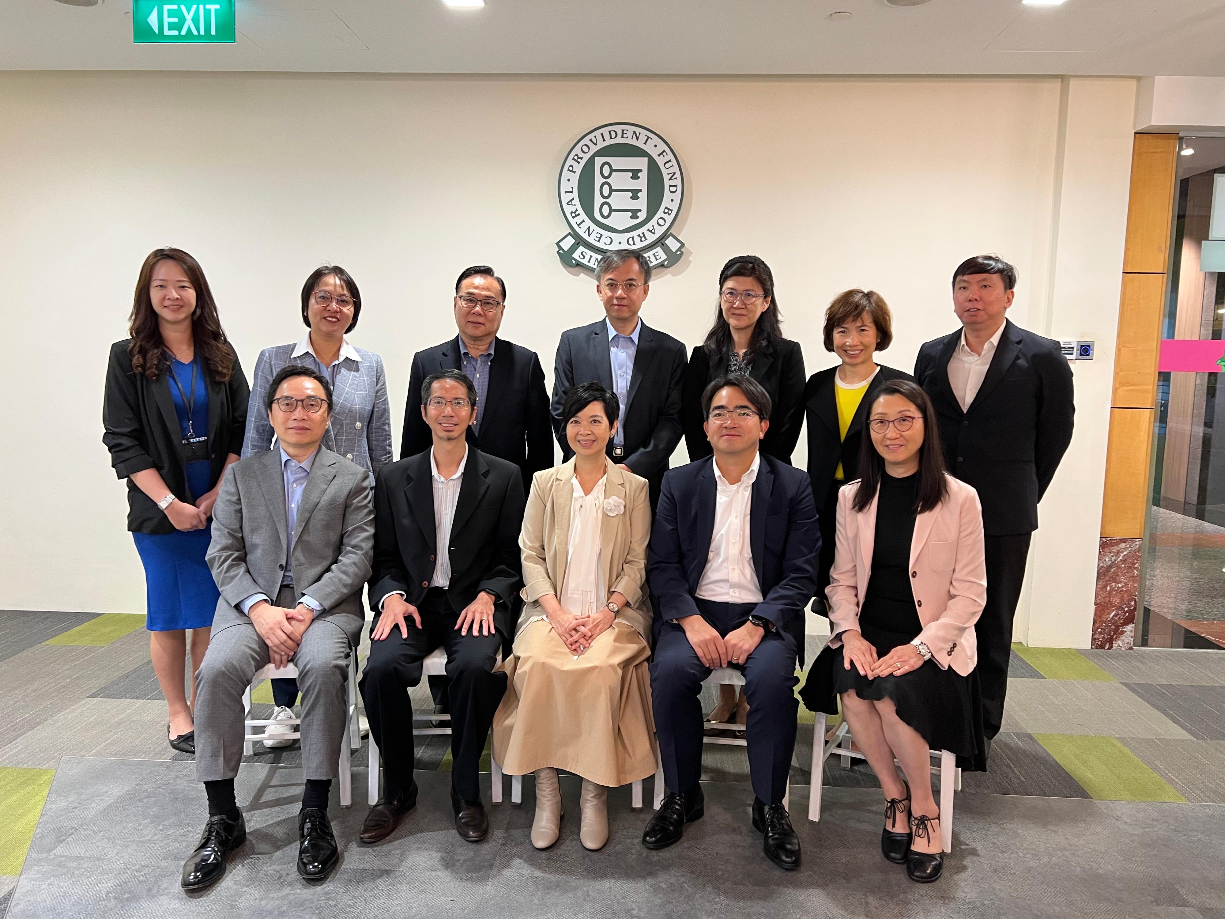 The Secretary for Housing, Ms Winnie Ho, was on the fourth day of her visit to Singapore today (August 25). Photo shows Ms Ho (front row, centre) with the Group Director of Policy, Statistics & Research of the Central Provident Fund Board, Mr Gregory Chia (front row, second left), today.