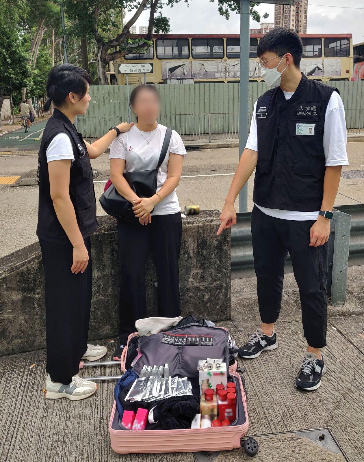 The Immigration Department mounted a series of territory-wide anti-illegal worker operations codenamed "Contribute" and "Twilight", and joint operations with the Hong Kong Police Force codenamed "Champion" and "Windsand", for four consecutive days from August 21 to yesterday (August 24). Photo shows a Mainland visitor involved in suspected parallel trading activities and her goods.