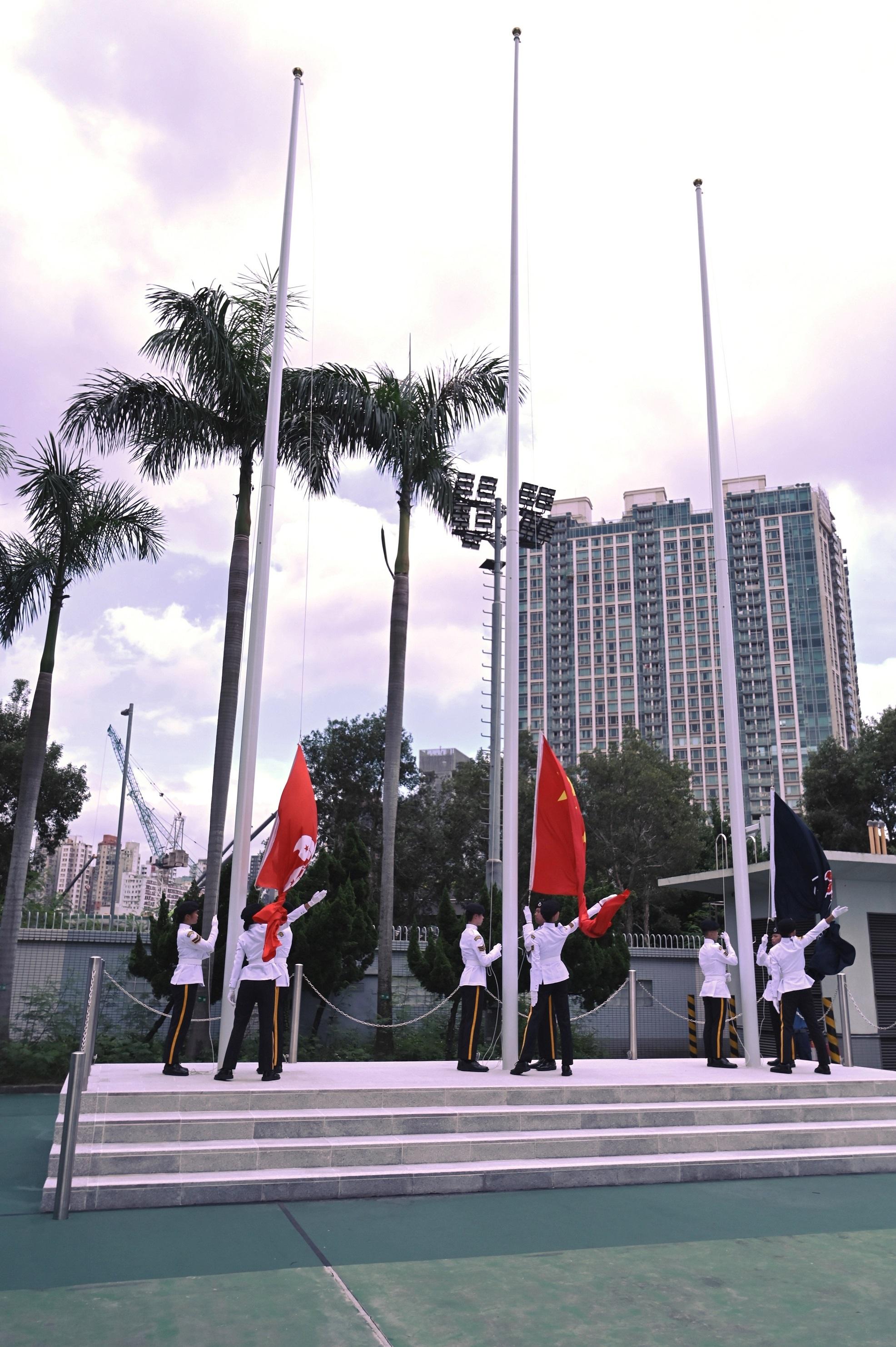 The Civil Aid Service Cadet Corps held the 138th New Cadets Passing-out Parade today (August 26). Photo shows the Cadet Corps Guard of Honour performing a flag-raising ceremony.
