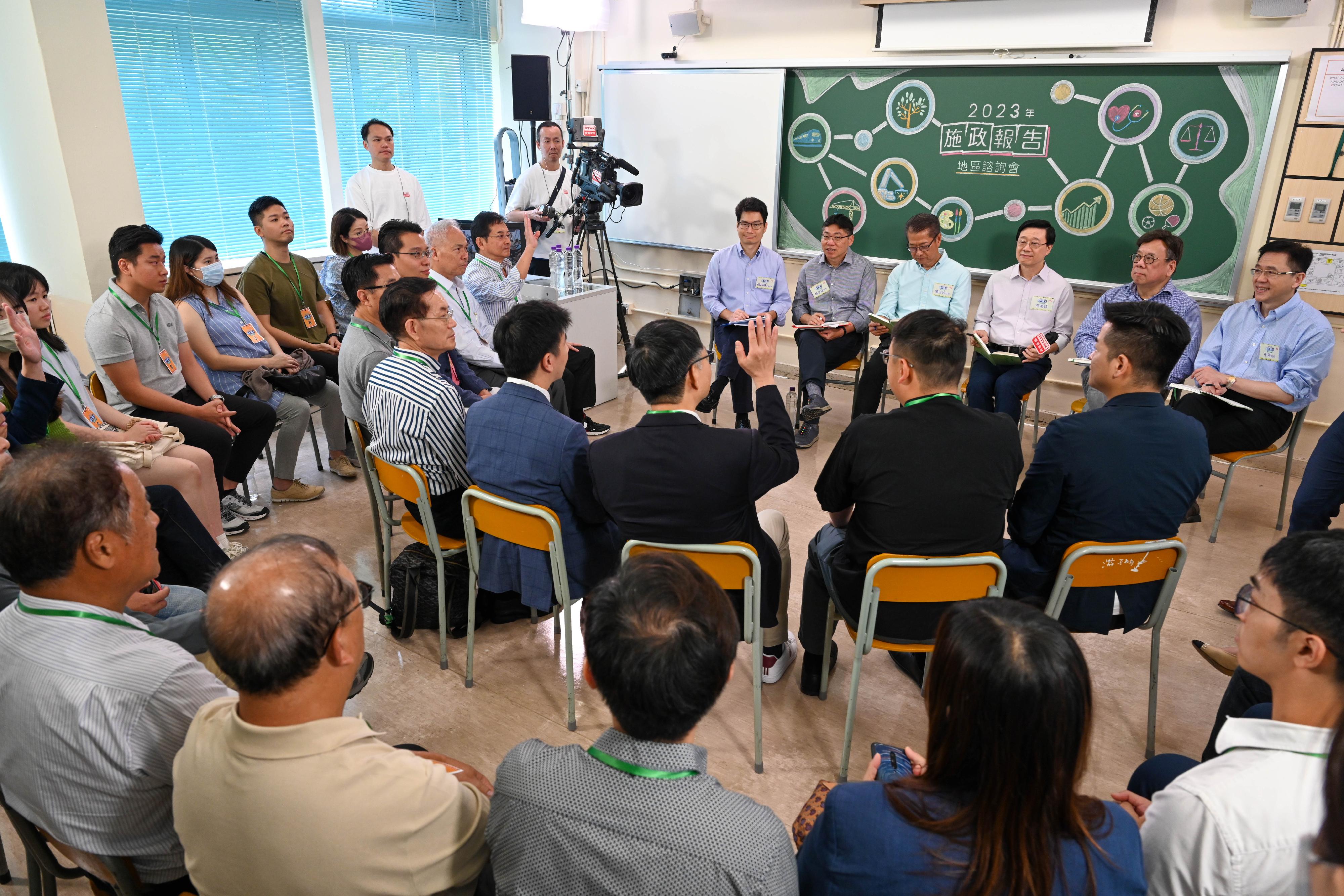 The Chief Executive, Mr John Lee, attended the second 2023 Policy Address District Forum with Principal Officials this morning (August 27) to listen to views and suggestions of local community members on the upcoming Policy Address. Photo shows Mr Lee (third right); the Financial Secretary, Mr Paul Chan (third left); the Secretary for Commerce and Economic Development, Mr Algernon Yau (second right); the Secretary for Transport and Logistics, Mr Lam Sai-hung (second left); the Secretary for Innovation, Technology and Industry, Professor Sun Dong (first right); and the Acting Secretary for Financial Services and the Treasury, Mr Joseph Chan (first left), listening to views of the public at the consultation session.