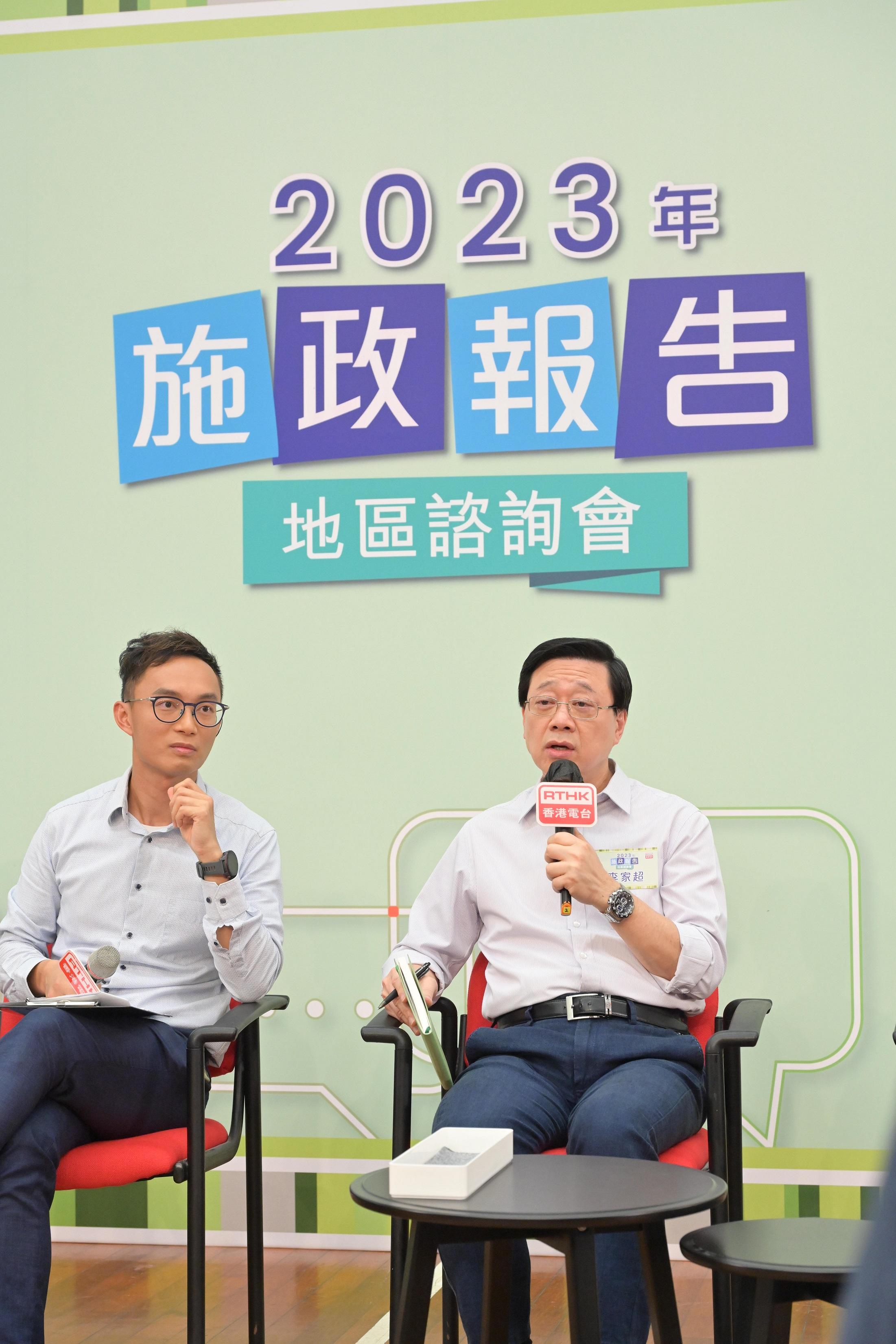 The Chief Executive, Mr John Lee, attended the second 2023 Policy Address District Forum with Principal Officials this morning (August 27) to listen to views and suggestions of local community members on the upcoming Policy Address. Photo shows Mr Lee (right) listening to views of the public at the consultation session.
