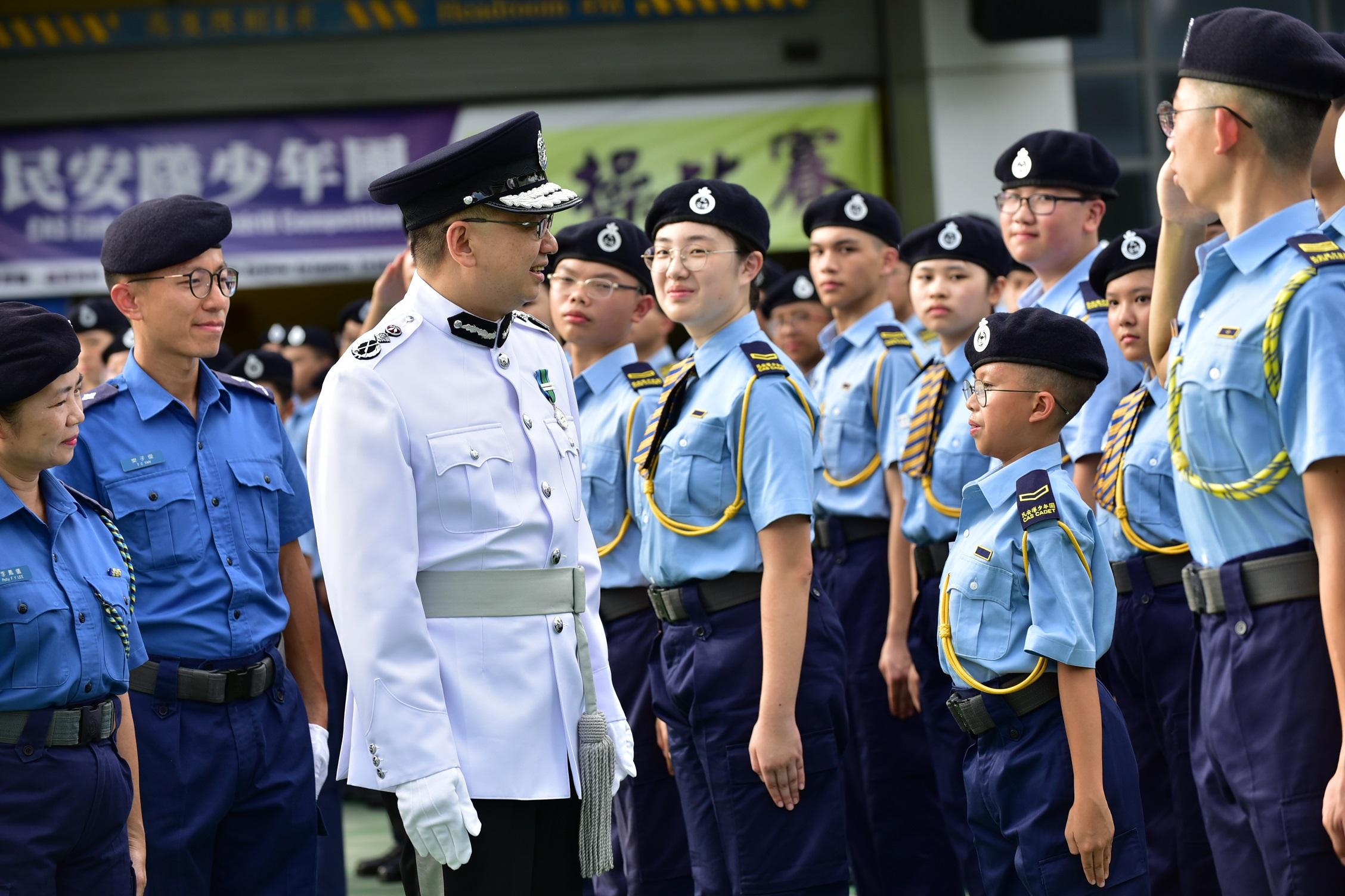 The Acting Director of Immigration, Mr Benson Kwok, reviewed the teams participating in the Civil Aid Service Cadet Corps Foot Drill Competition 2023 today (August 27).