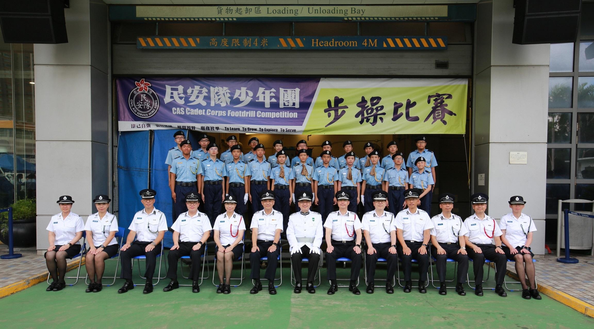 The Civil Aid Service Cadet Corps Foot Drill Competition 2023 was held today (August 27). Photo shows the Acting Director of Immigration, Mr Benson Kwok (first row, centre) with the representatives of the winning team.