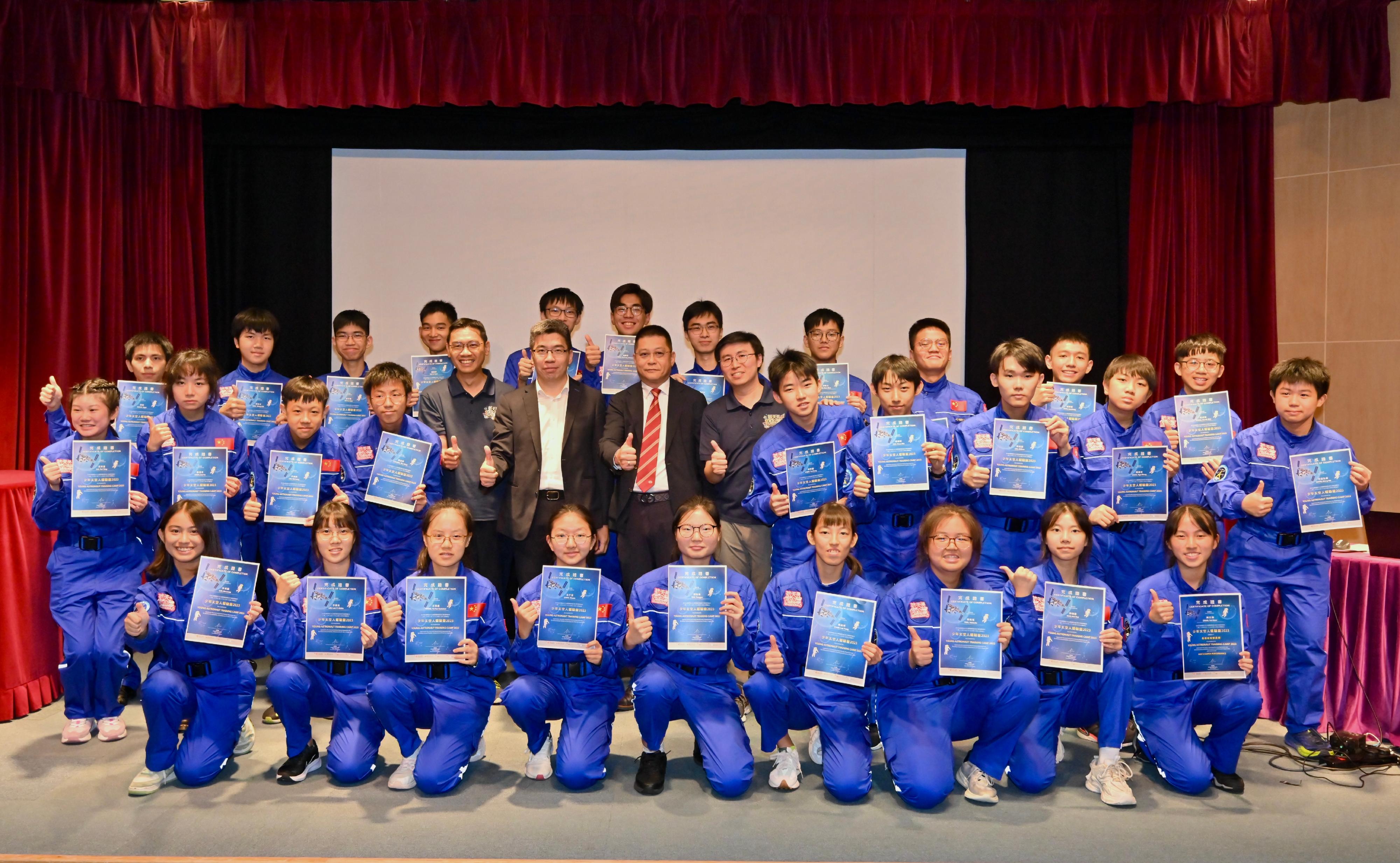 A sharing session for the Young Astronaut Training Camp 2023 was held at the Hong Kong Space Museum today (August 29). Photo shows (middle row, from fifth left) the Curator of the Hong Kong Space Museum, Mr Timothy Ho; the President of the Beijing-Hong Kong Academic Exchange Centre, Mr Hsu Hoi-shan; Vice Chairman of the Chinese General Chamber of Commerce Mr Ricky Tsang; and the Assistant Curator I (Youth Programme) of Hong Kong Space Museum, Mr Chan Chun-lam, with the students. 