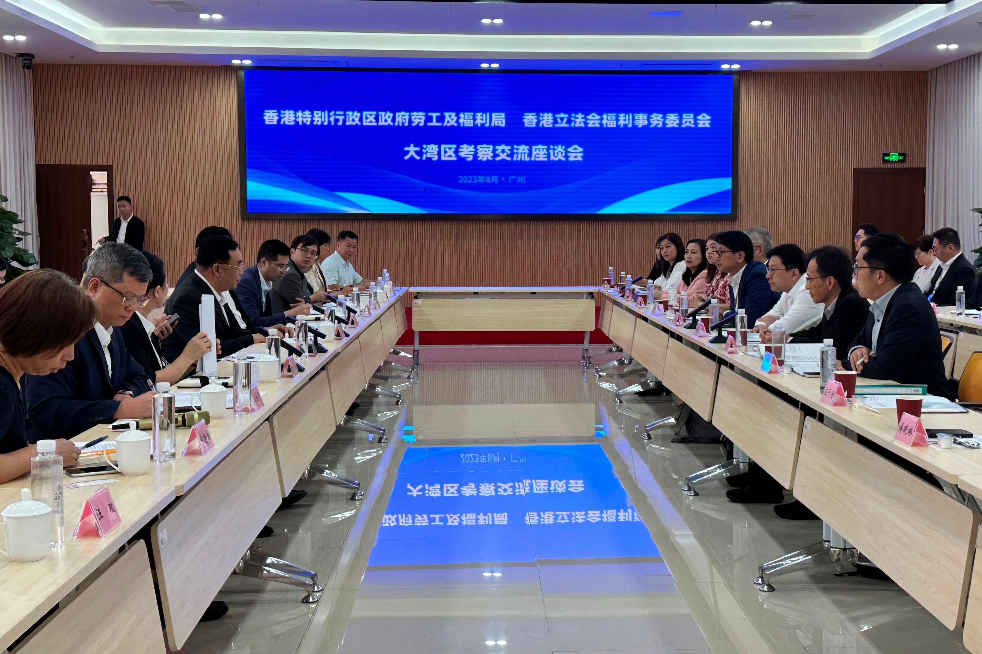 The Secretary for Labour and Welfare, Mr Chris Sun, leading a delegation of the Labour and Welfare Bureau, today (August 30) started his visit to three Mainland cities in the Guangdong-Hong Kong-Macao Greater Bay Area, together with a delegation of the Legislative Council Panel on Welfare Services. Photo shows Mr Sun (third right) in a joint seminar with the Department of Civil Affairs of Guangdong Province while in Guangzhou this afternoon, exchanging views on deepening the implementation of cross-boundary elderly care.