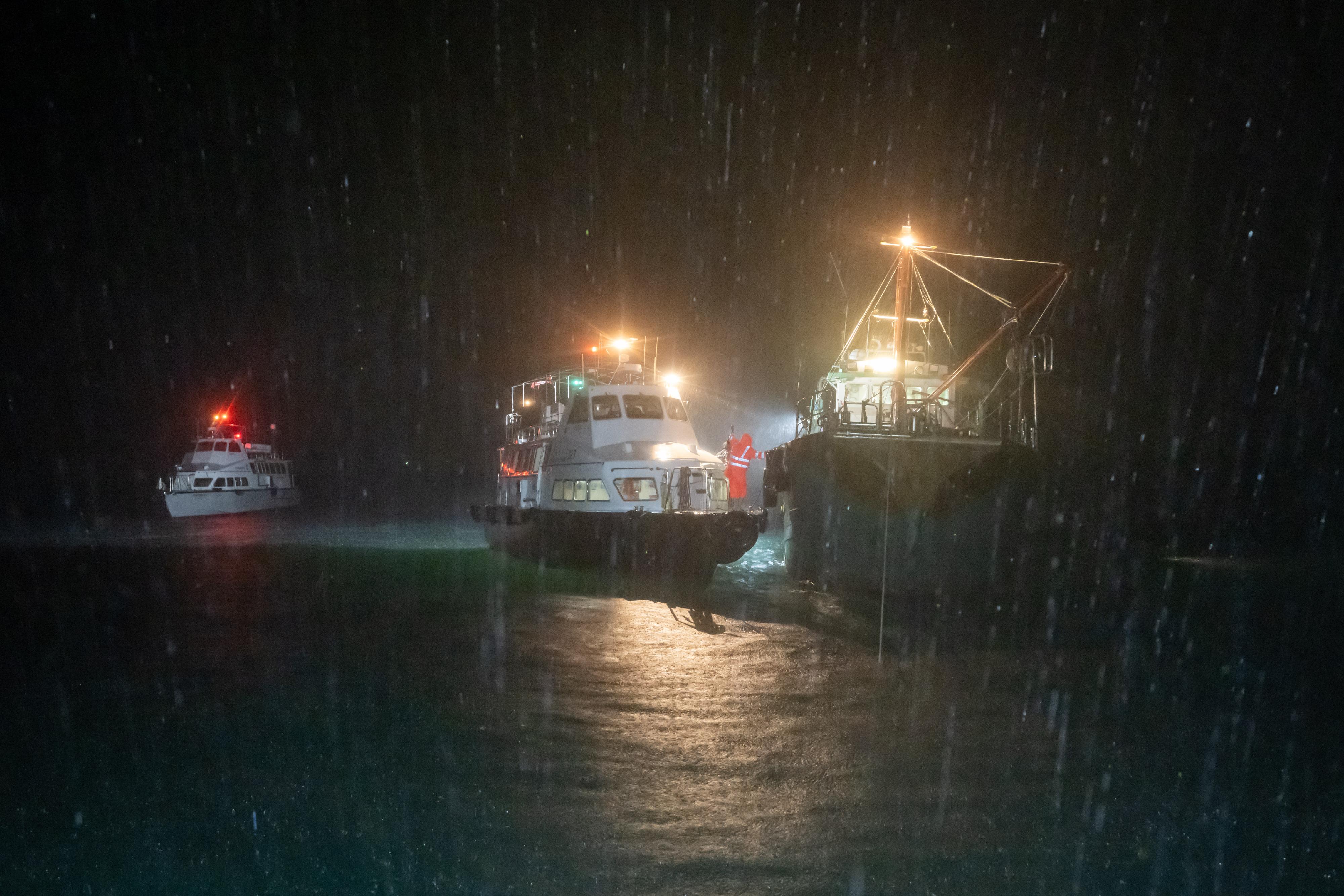 The Marine Department (MD) together with the Hong Kong Police Force and the Agriculture, Fisheries and Conservation Department conducted a joint operation against the improper use of bright light for fishing and illegal fishing activities in the southern waters of Hong Kong on September 7. Photo shows MD officers about to inspect a fishing vessel.