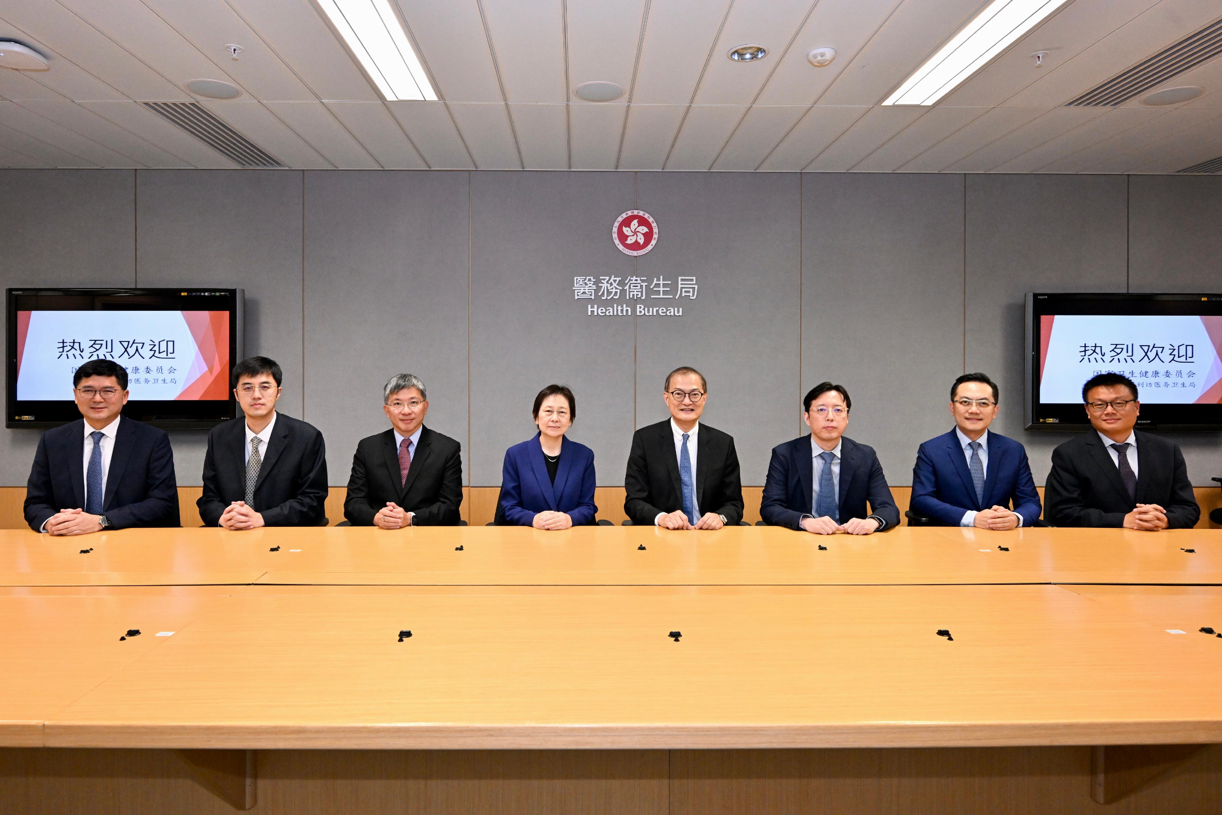 The Secretary for Health, Professor Lo Chung-mau, met with a delegation led by the Director General of the Office of Hong Kong, Macao and Taiwan Affairs of the National Health Commission, Ms Zhang Yang, today (September 12). Photo shows Professor Lo (fourth right); Ms Zhang (fourth left); the Permanent Secretary for Health, Mr Thomas Chan (third left); the Director of Health, Dr Ronald Lam (second right); the Chief Executive of the Hospital Authority, Dr Tony Ko (first left), and other attendees of the meeting.