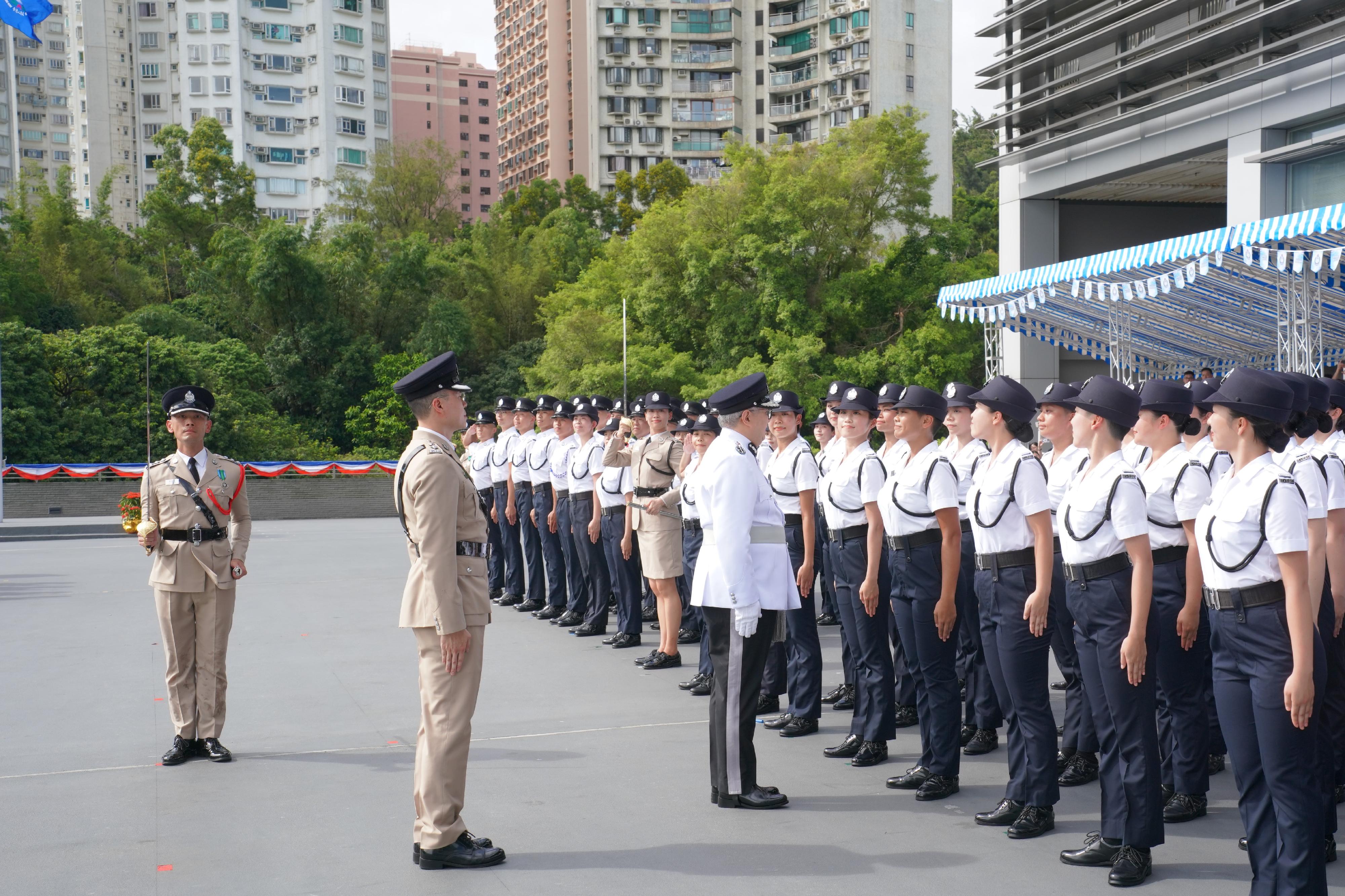 The Director of Immigration, Mr Au Ka-wang, inspects a contingent of graduates at the Immigration Service Institute of Training and Development Passing-out Parade today (September 13).