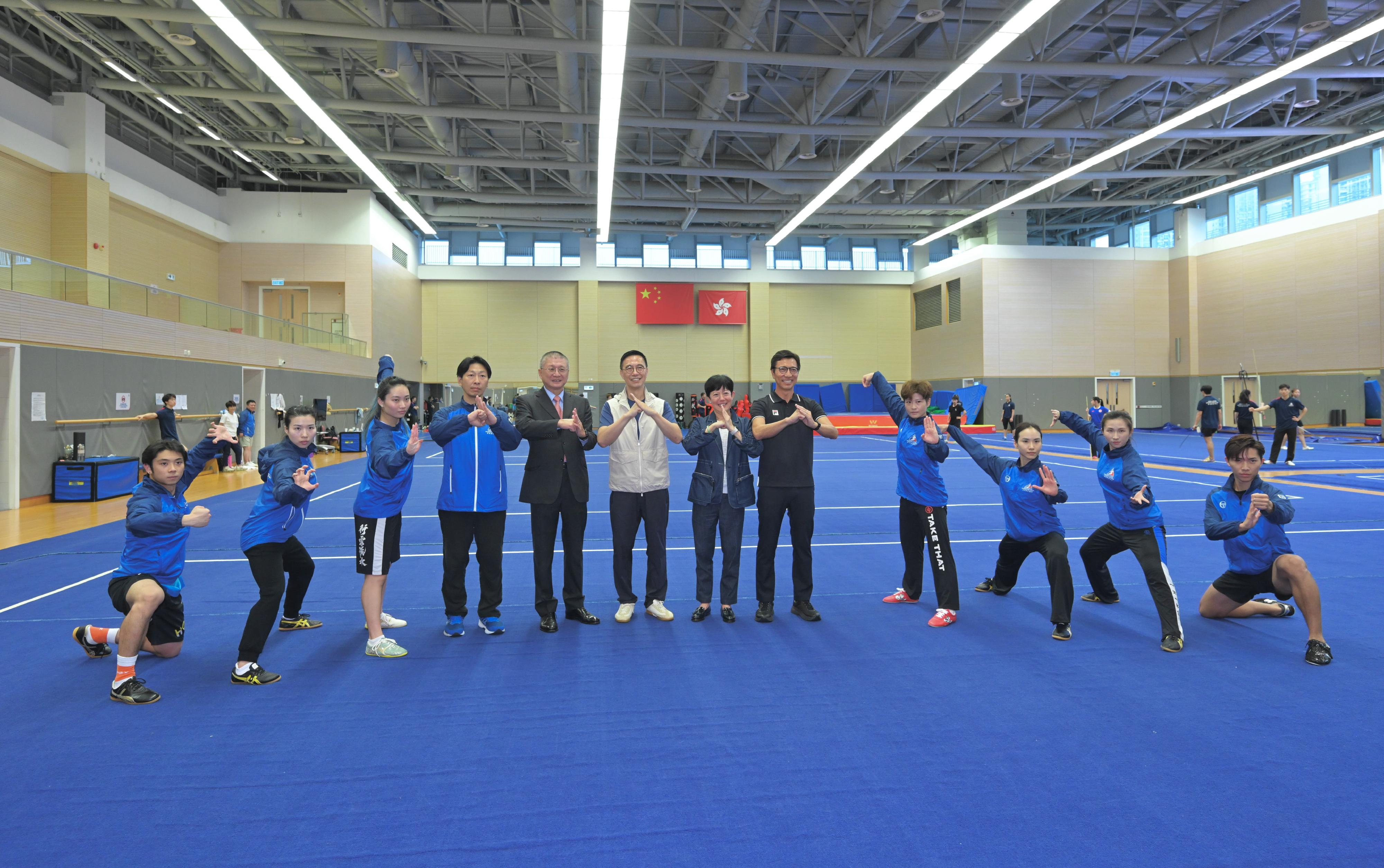 The Secretary for Culture, Sports and Tourism, Mr Kevin Yeung (sixth left), and the Commissioner for Sports, Mr Sam Wong (fifth right), this morning (September 14) visited the Wushu hall in the Hong Kong Sports Institute to express their best wishes to the athletes, hoping that they would give their best and bring glory to Hong Kong.