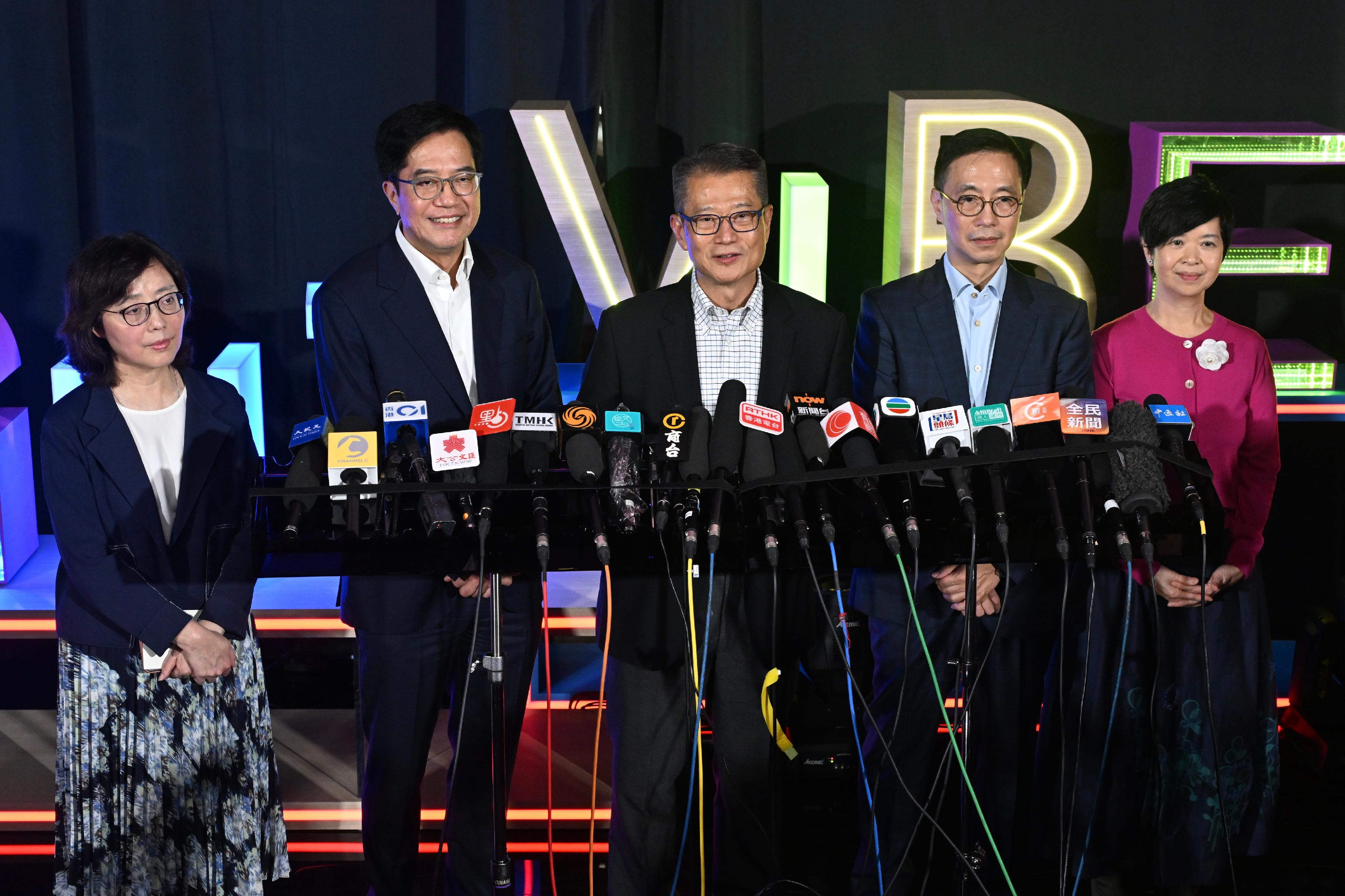 The Financial Secretary, Mr Paul Chan (centre), together with the Deputy Financial Secretary, Mr Michael Wong (second left); the Secretary for Culture, Sports and Tourism, Mr Kevin Yeung (second right); the Secretary for Development, Ms Bernadette Linn (first left); and the Secretary for Housing, Ms Winnie Ho (first right), meet the media after hosting the "Night Vibes Hong Kong" Campaign Launch Ceremony this evening (September 14).