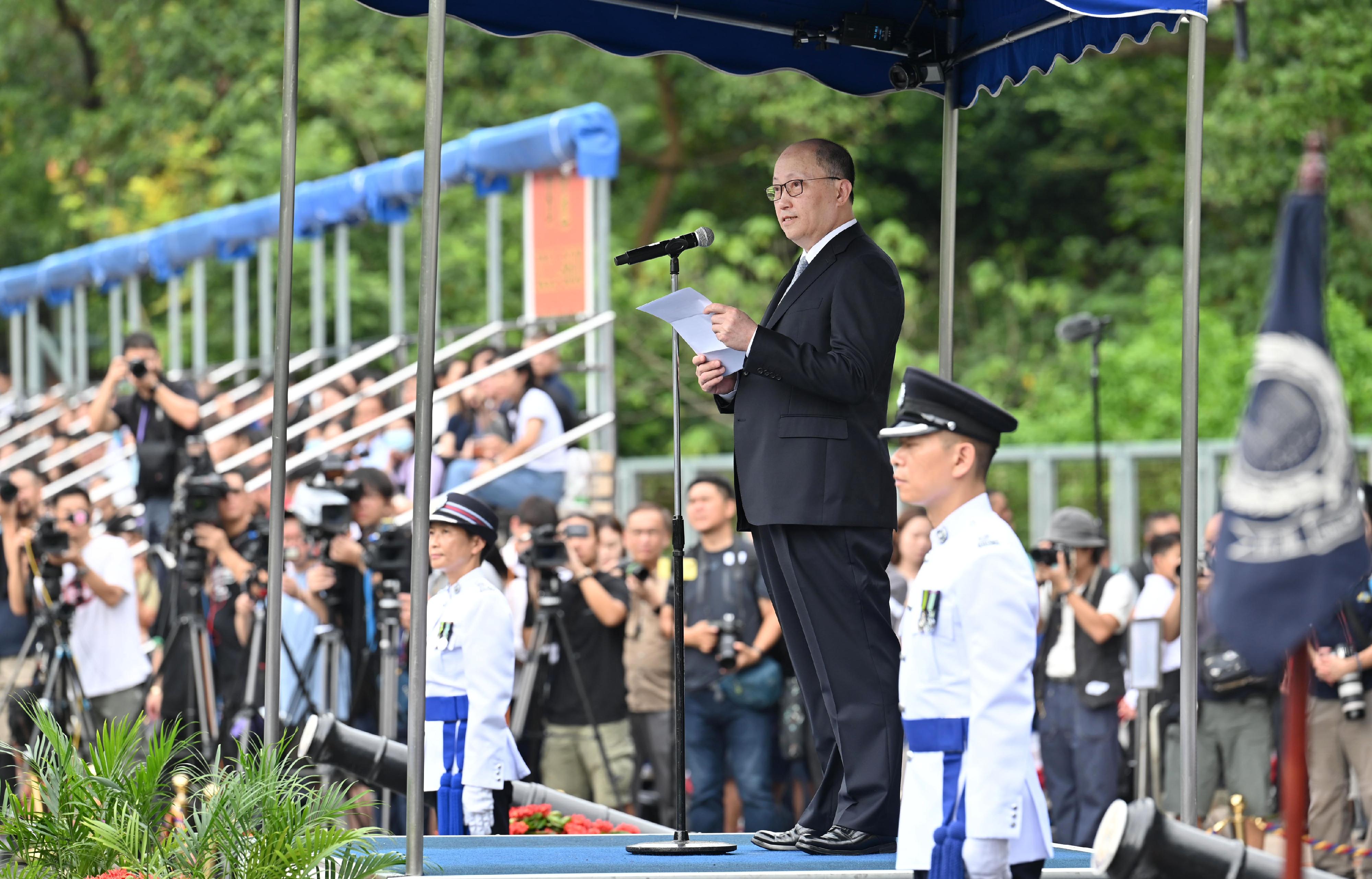 The Director of the Liaison Office of the Central People's Government in the Hong Kong Special Administrative Region, Mr Zheng Yanxiong, speaks at a passing-out parade held at the Hong Kong Police College today (September 16).