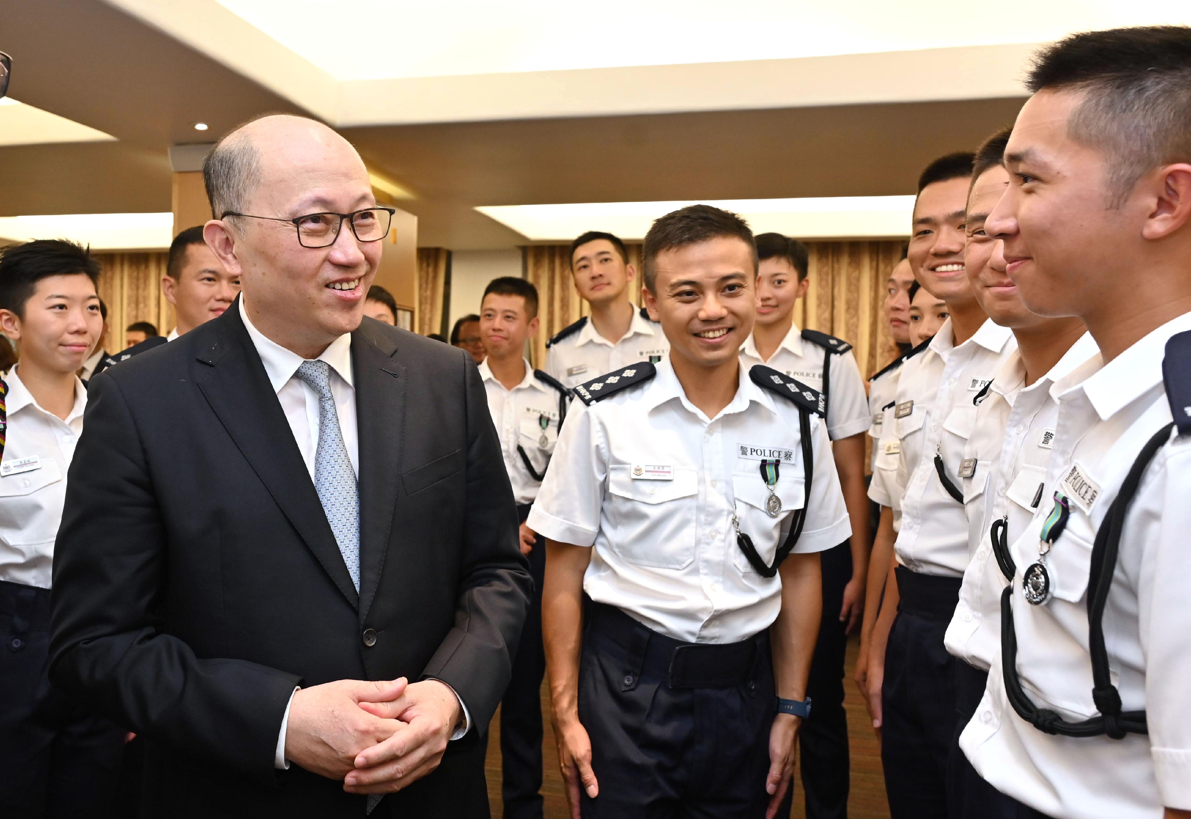 The Director of the Liaison Office of the Central People's Government in the Hong Kong Special Administrative Region, Mr Zheng Yanxiong (front row, first left), congratulates the probationary inspectors after the passing-out parade held at the Hong Kong Police College today (September 16).