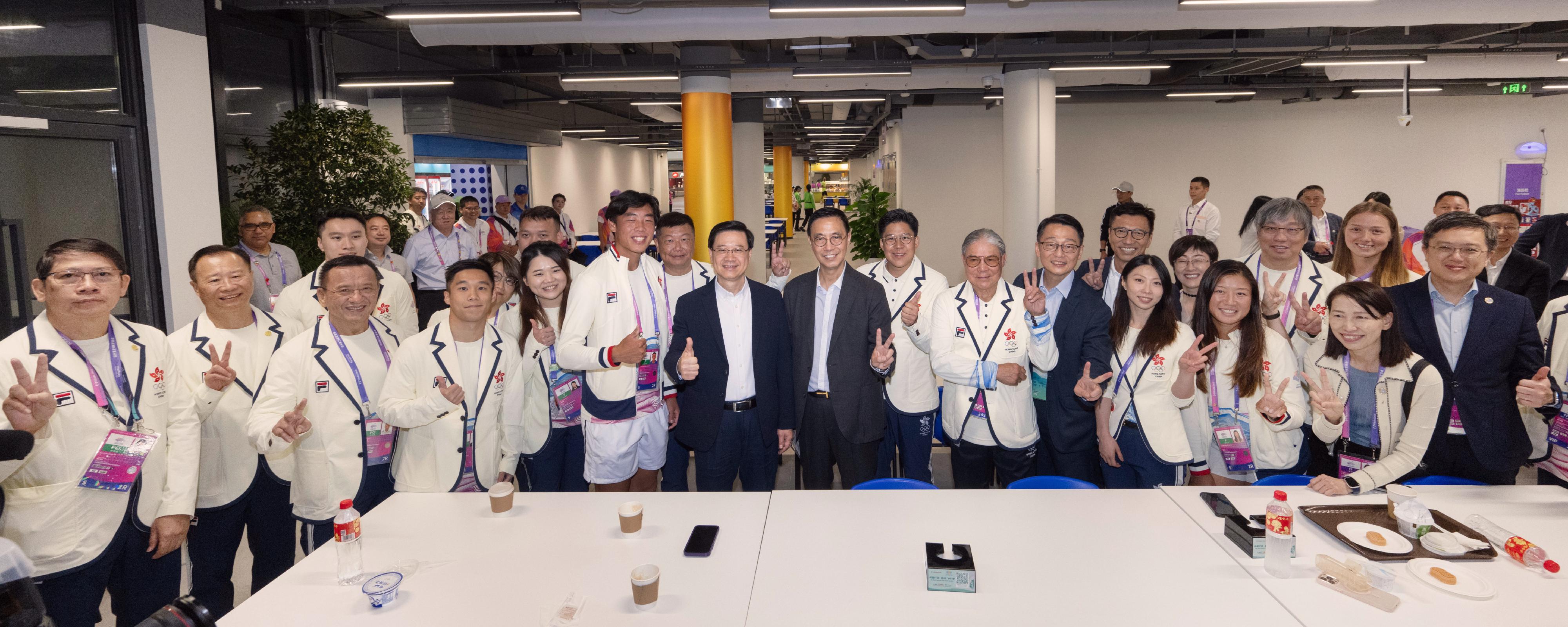 The Chief Executive, Mr John Lee, led a delegation of the Hong Kong Special Administrative Region Government to attend the opening ceremony of the 19th Asian Games Hangzhou (Asian Games) today (September 22). Photo shows Mr Lee (front row, eighth right); the Secretary for Culture, Sports and Tourism, Mr Kevin Yeung (front row, seventh right); the Director of the Chief Executive's Office, Ms Carol Yip (front row, first right); the Director of Leisure and Cultural Services, Mr Vincent Liu (front row, fourth right); the President of the Sports Federation & Olympic Committee of Hong Kong, China, Mr Timothy Fok (front row, fifth right); and the Chef de Mission of the Hong Kong, China Delegation to the Asian Games, Mr Kenneth Fok (front row, sixth right), with Hong Kong athletes.