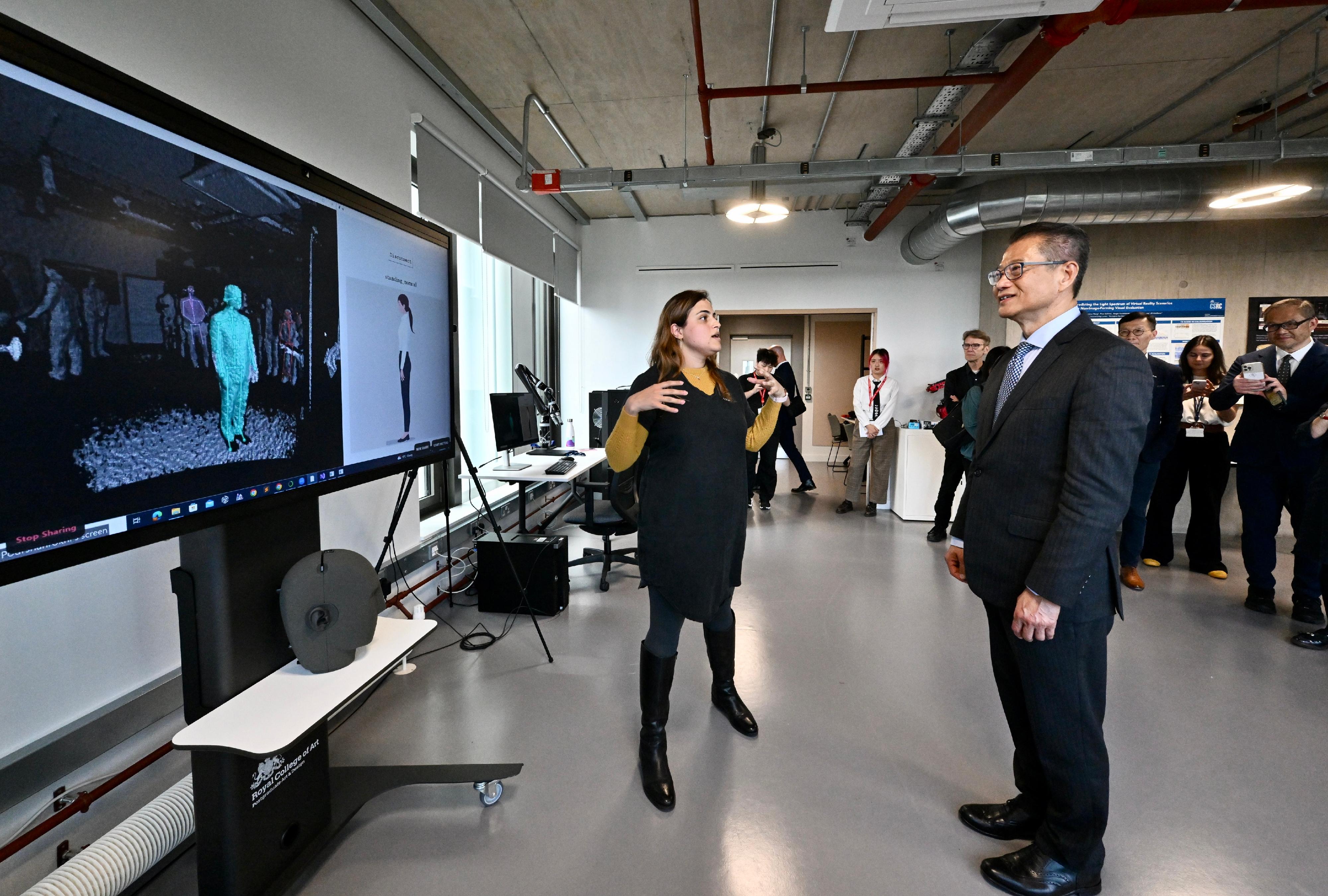 The Financial Secretary, Mr Paul Chan, continued his visit to London, the UK yesterday (September 22, London time), and visited the Royal College of Art (RCA). The Hong Kong Polytechnic University and the RCA jointly established the Laboratory for Artificial Intelligence in Design (AiDLab) in 2021. Photo shows Mr Chan (first row, right) touring the display of research application projects. 