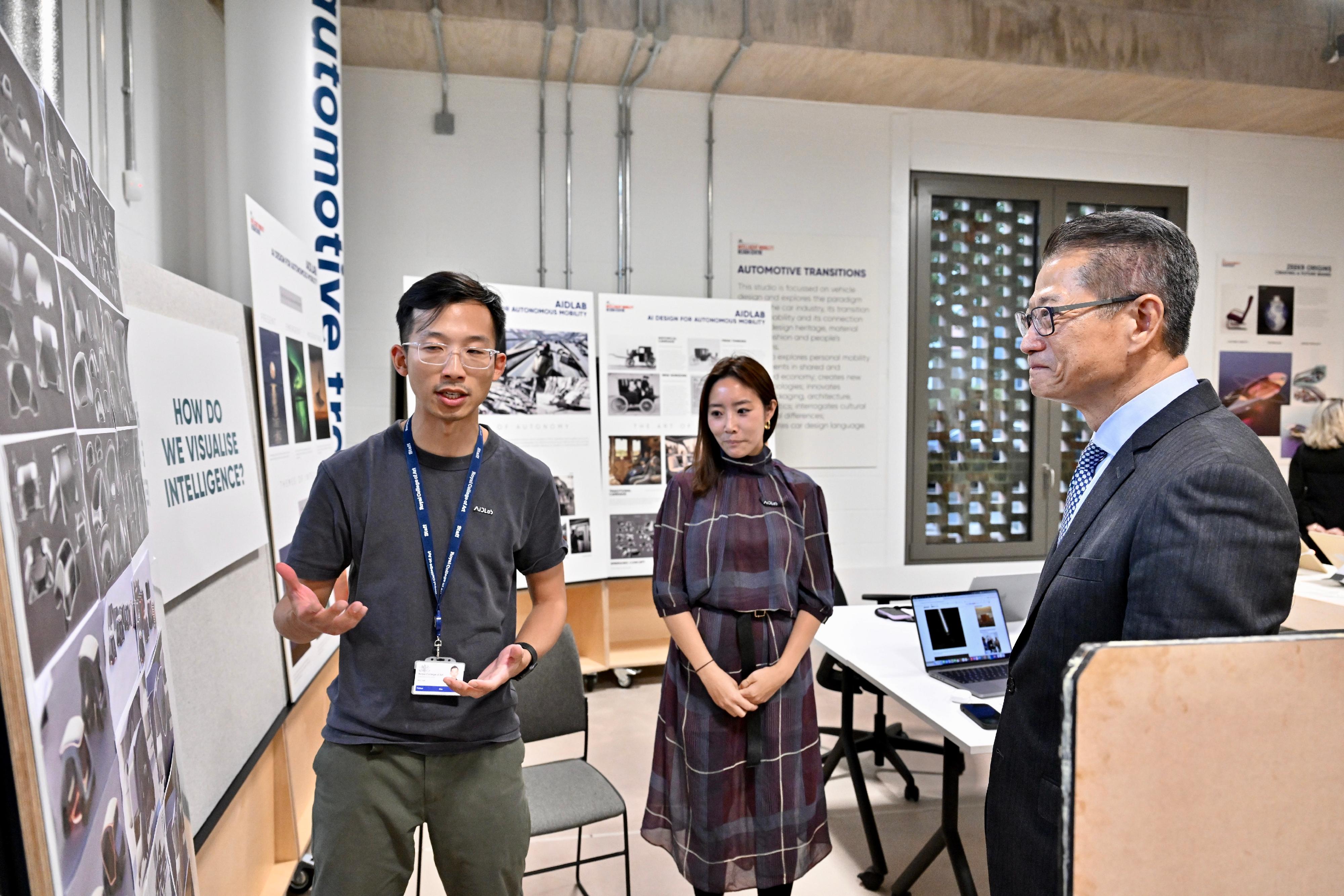 The Financial Secretary, Mr Paul Chan, continued his visit to London, the UK yesterday (September 22, London time), and visited the Royal College of Art (RCA). The Hong Kong Polytechnic University and the RCA jointly established the Laboratory for Artificial Intelligence in Design (AiDLab) in 2021. Photo shows Mr Chan (right) touring the display of research application projects. 