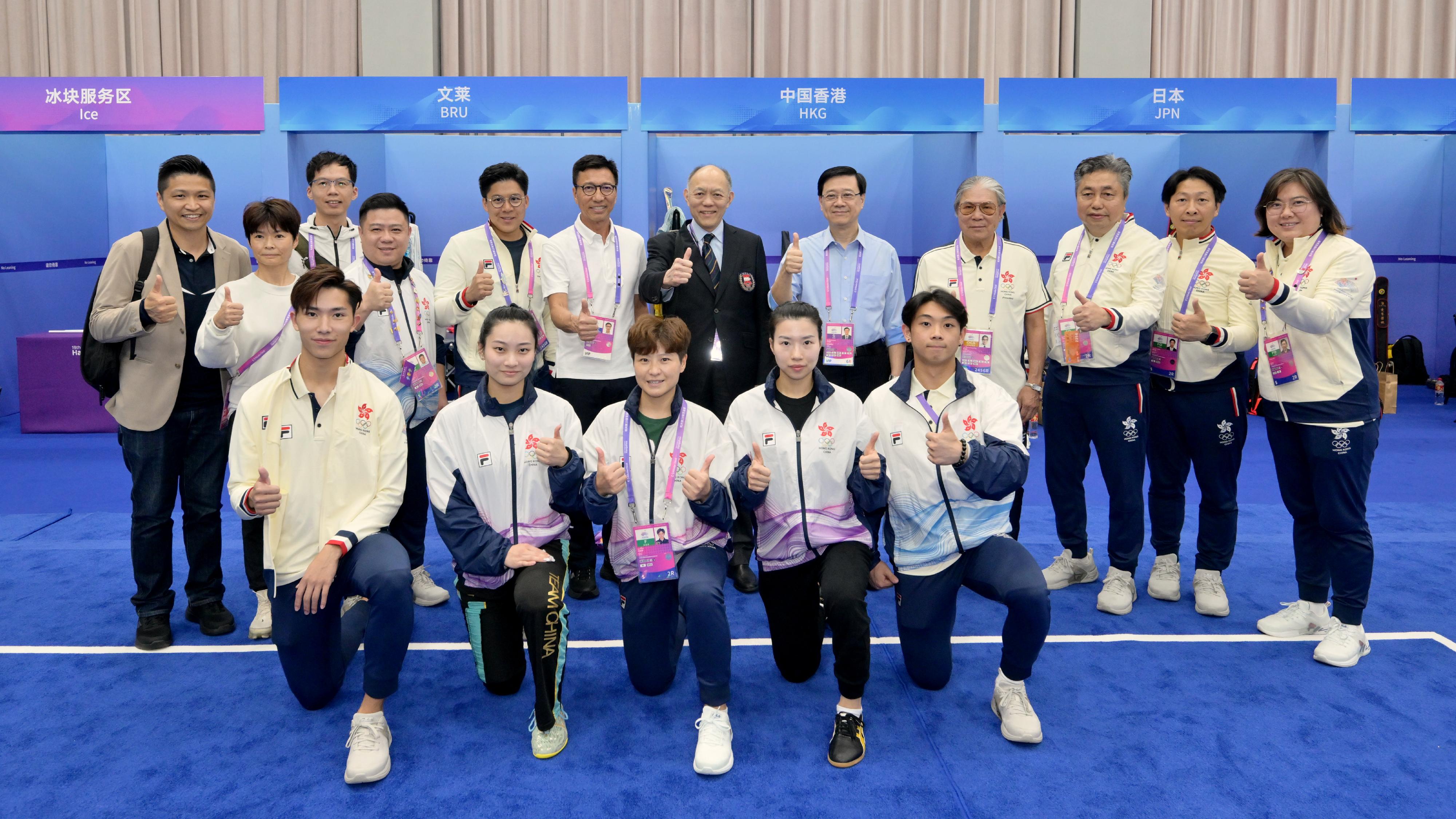 The Chief Executive, Mr John Lee, led a Hong Kong Special Administrative Region Government delegation to Hangzhou and continued his visit programme today (September 24). Photo shows Mr Lee (back row, fifth right); the President of the Sports Federation & Olympic Committee of Hong Kong, China, Mr Timothy Fok (back row, fourth right); and the Chef de Mission of the Hong Kong, China Delegation to the 19th Asian Games Hangzhou, Mr Kenneth Fok (back row, fifth left); and the Commissioner for Sports in the Culture, Sports and Tourism Bureau, Mr Sam Wong (back row, sixth left), with Hong Kong athletes.