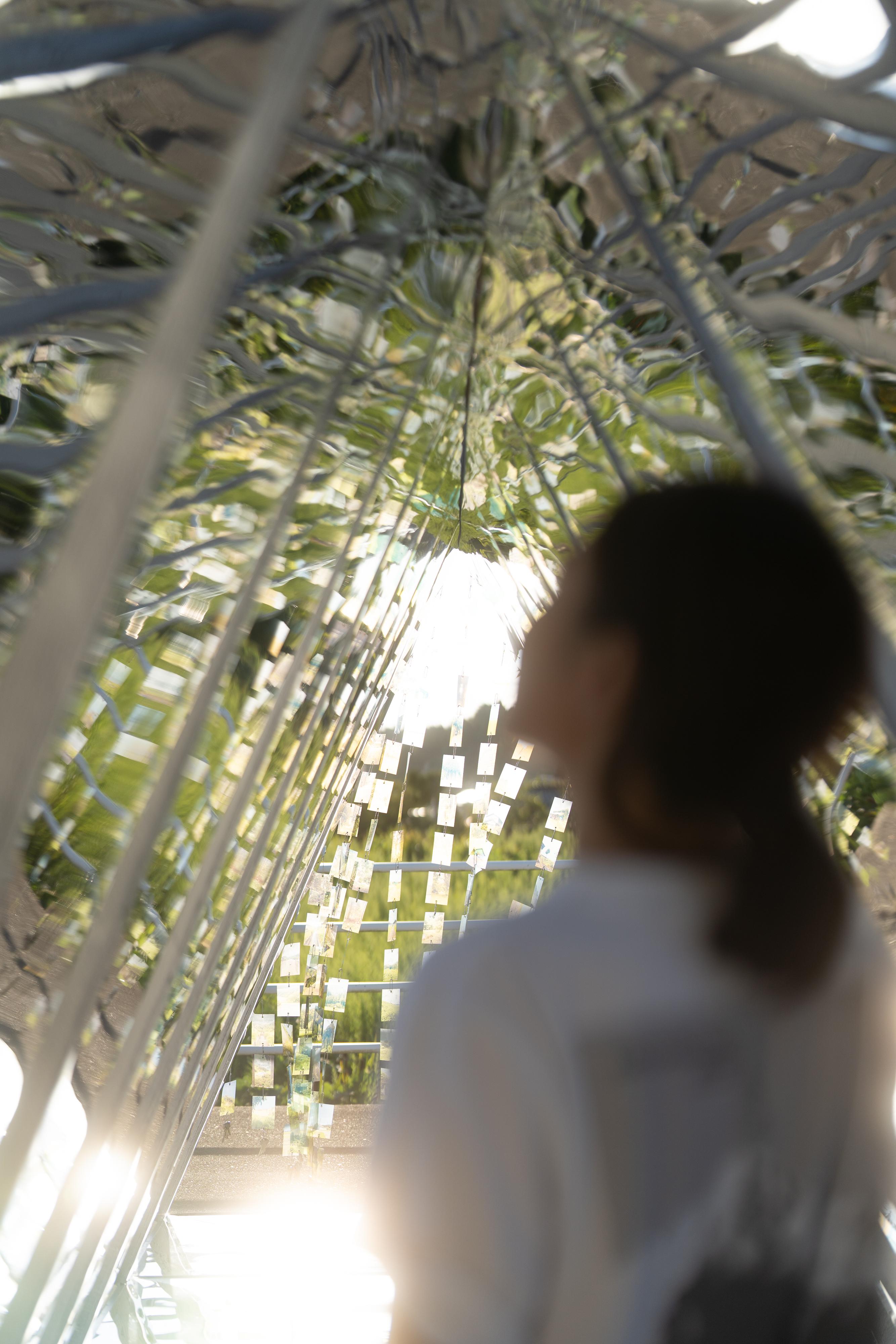 The Station by the Sea at Oku-Noto Triennale 2023 - Residence and Exhibition Programme is now being held until November 12 at the former Ukai Station in the city of Suzu on the Noto Peninsula. Photo shows visitors viewing the artwork "Secret Express" by Hong Kong artist Anthony Ko. 