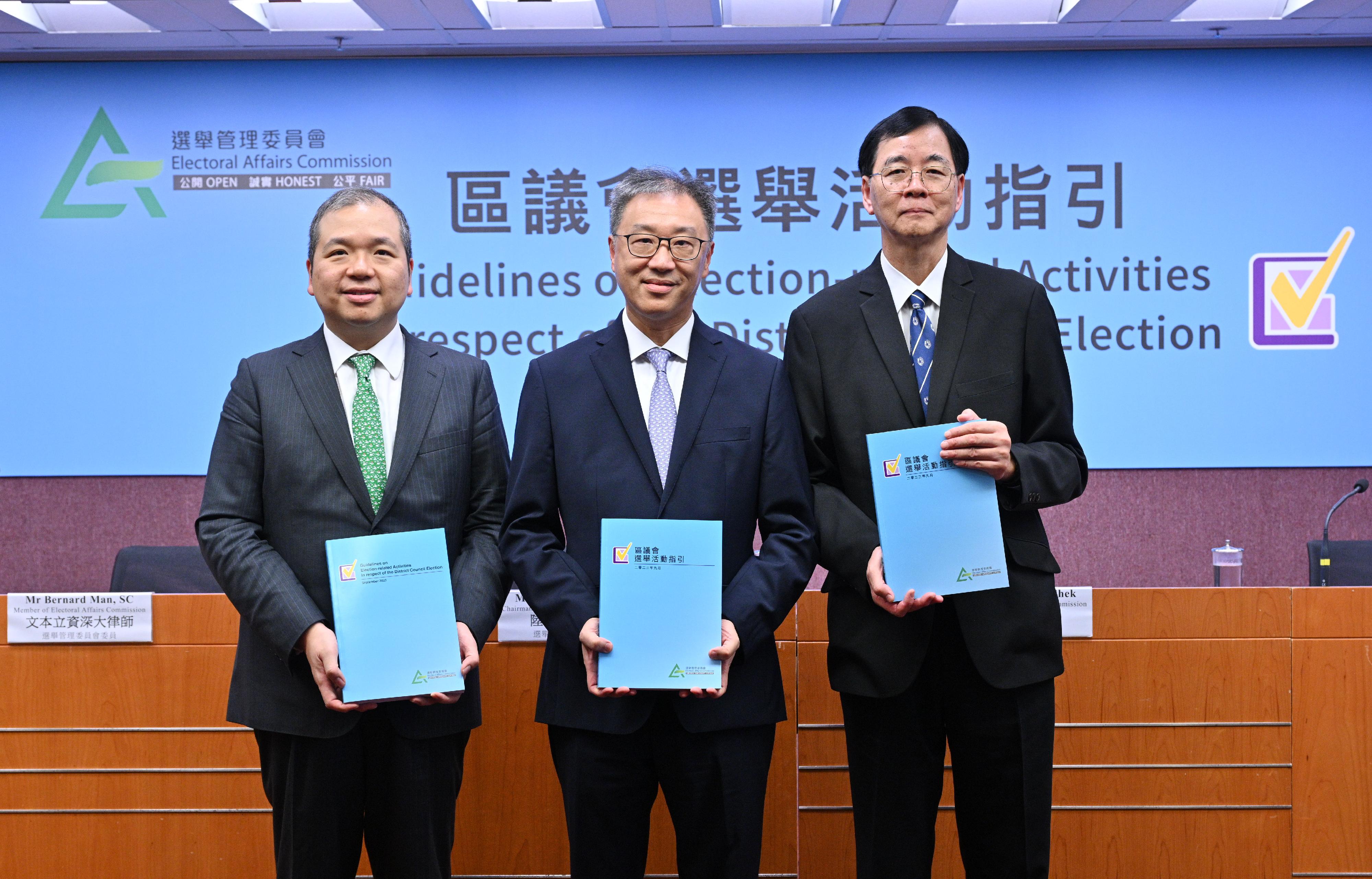 The Chairman of the Electoral Affairs Commission (EAC), Mr Justice David Lok (centre), and EAC members Professor Daniel Shek (right) and Mr Bernard Man, SC (left) present the Guidelines on Election-related Activities in respect of the District Council Election at a press conference today (September 28).
