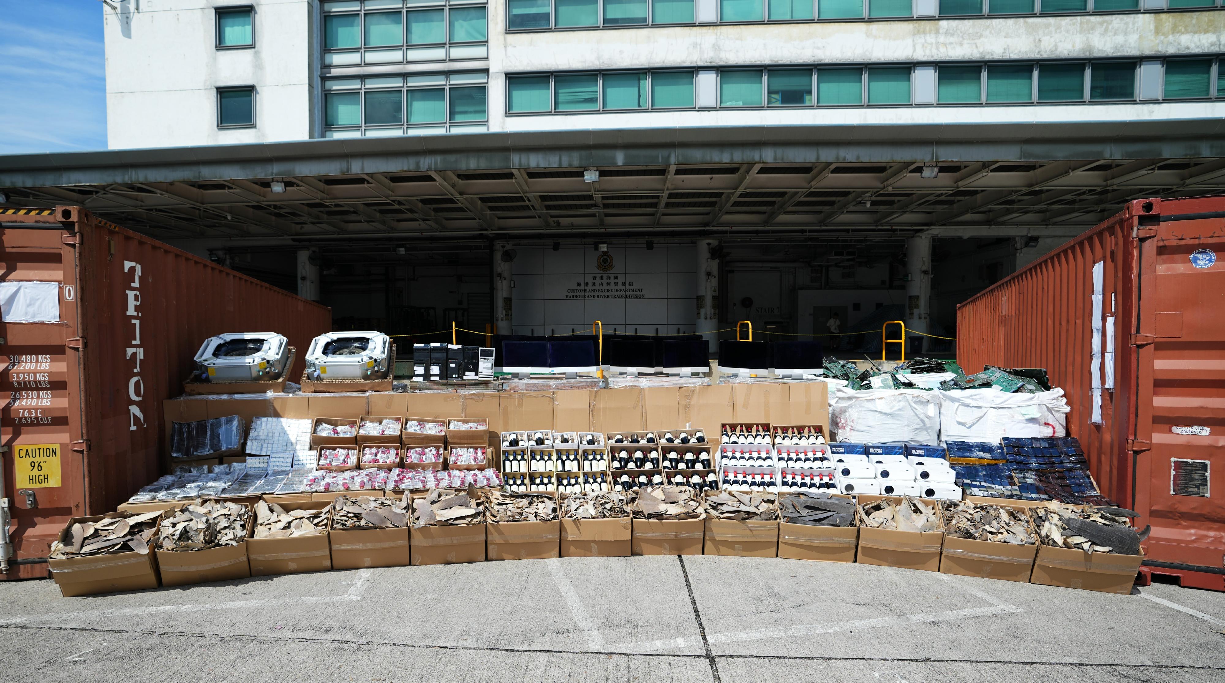 Hong Kong Customs mounted a special operation codenamed "Wave Breaker" from August to September and detected four suspected smuggling cases involving ocean-going vessels and two suspected smuggling cases involving river trade vessels. A large batch of suspected smuggled goods, including over 500 000 electronic products, about 2 000 bottles of table wines, about 240 pallets of electronic wastes, about seven tonnes of suspected scheduled shark fins, and about three tonnes of frozen meat, with a total estimated market value of about $100 million was seized. Photo shows some of the suspected smuggled goods seized.

