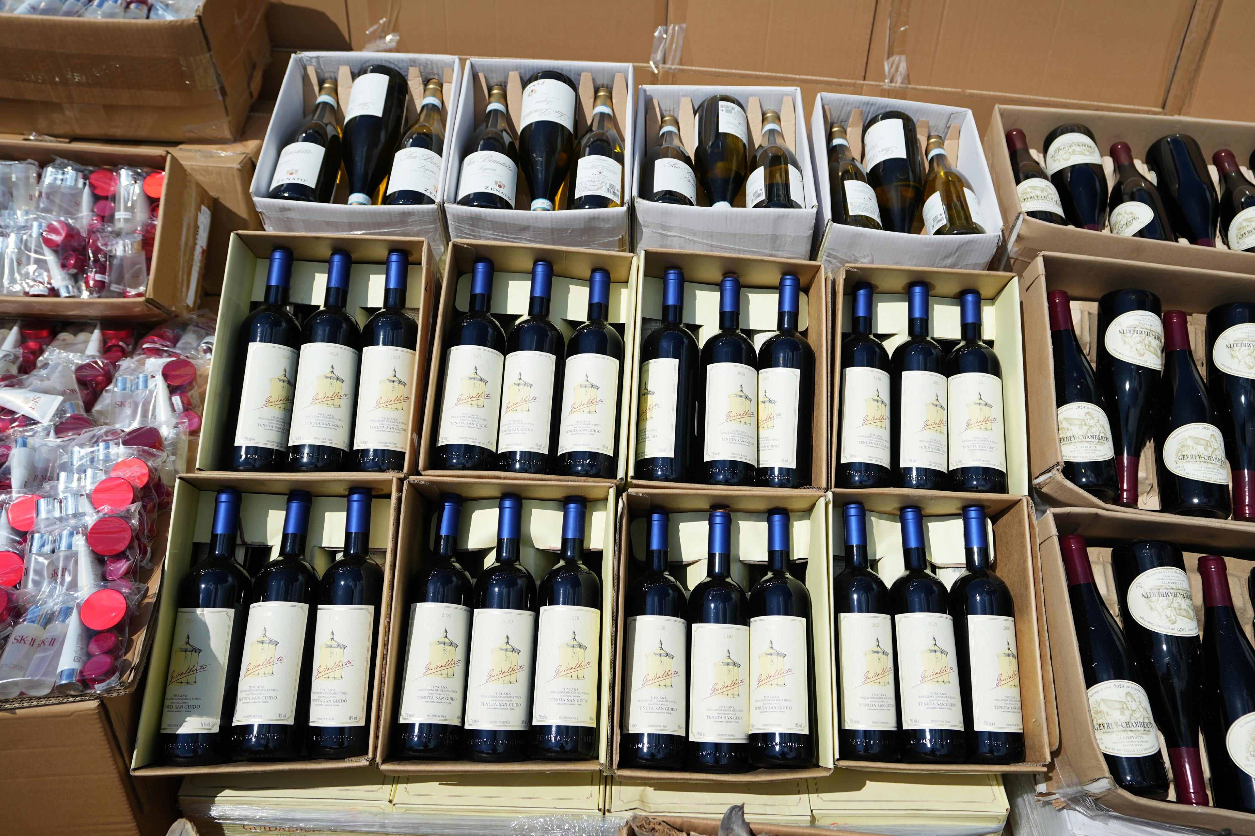 Hong Kong Customs mounted a special operation codenamed "Wave Breaker" from August to September and detected four suspected smuggling cases involving ocean-going vessels and two suspected smuggling cases involving river trade vessels. A large batch of suspected smuggled goods with a total estimated market value of about $100 million was seized. Photo shows some of the table wines seized.