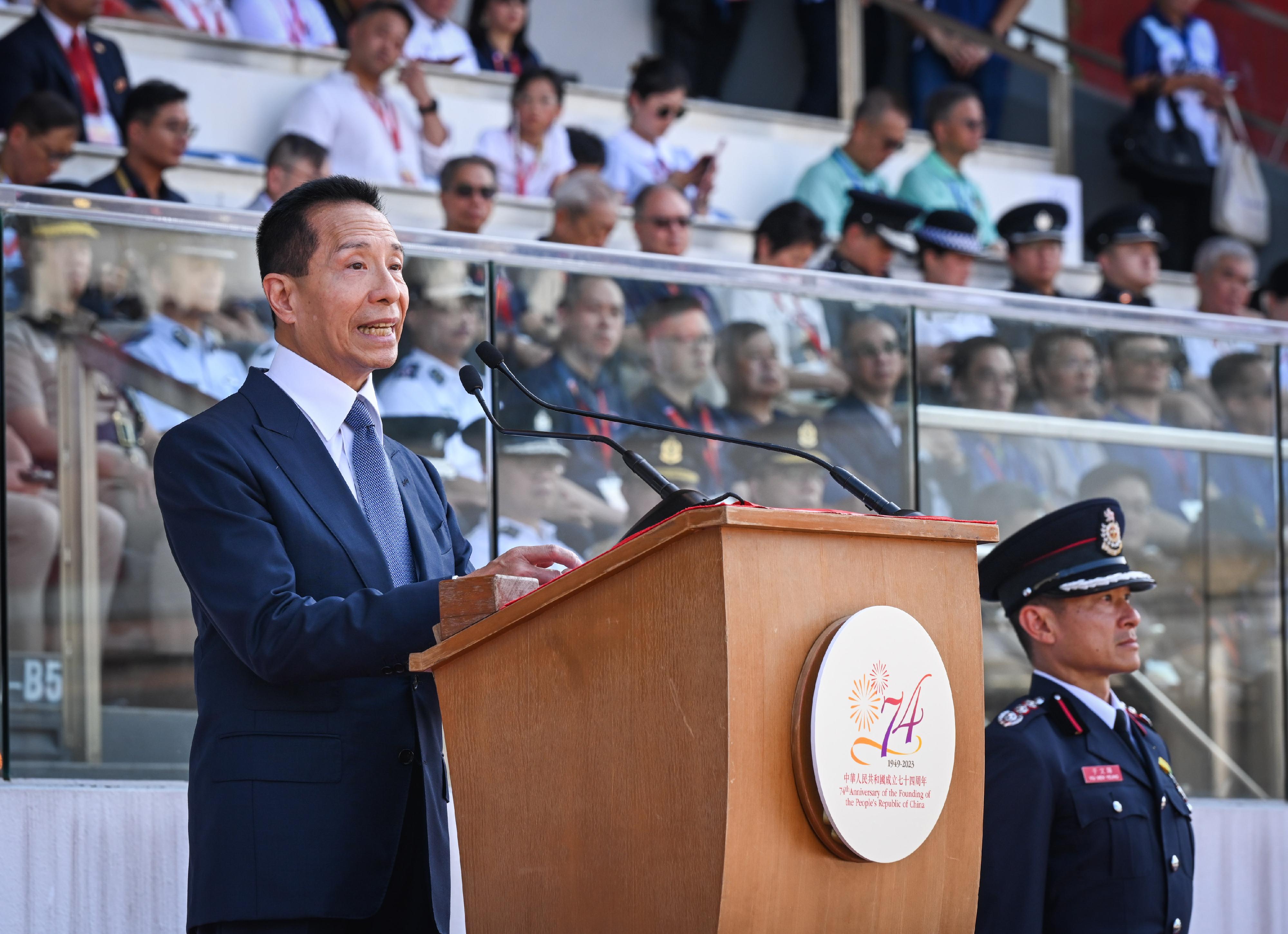 The Security Bureau led its disciplined services and auxiliary services, together with youth uniformed groups, to hold the Parade by Disciplined Services and Youth Groups cum Carnival for Celebrating the 74th Anniversary of the Founding of the People's Republic of China at the Fire and Ambulance Services Academy in Tseung Kwan O today (October 1) to celebrate the National Day with members of the public. Photo shows the officiating guest Mr Tang Yat-sun (first left) delivering a speech.