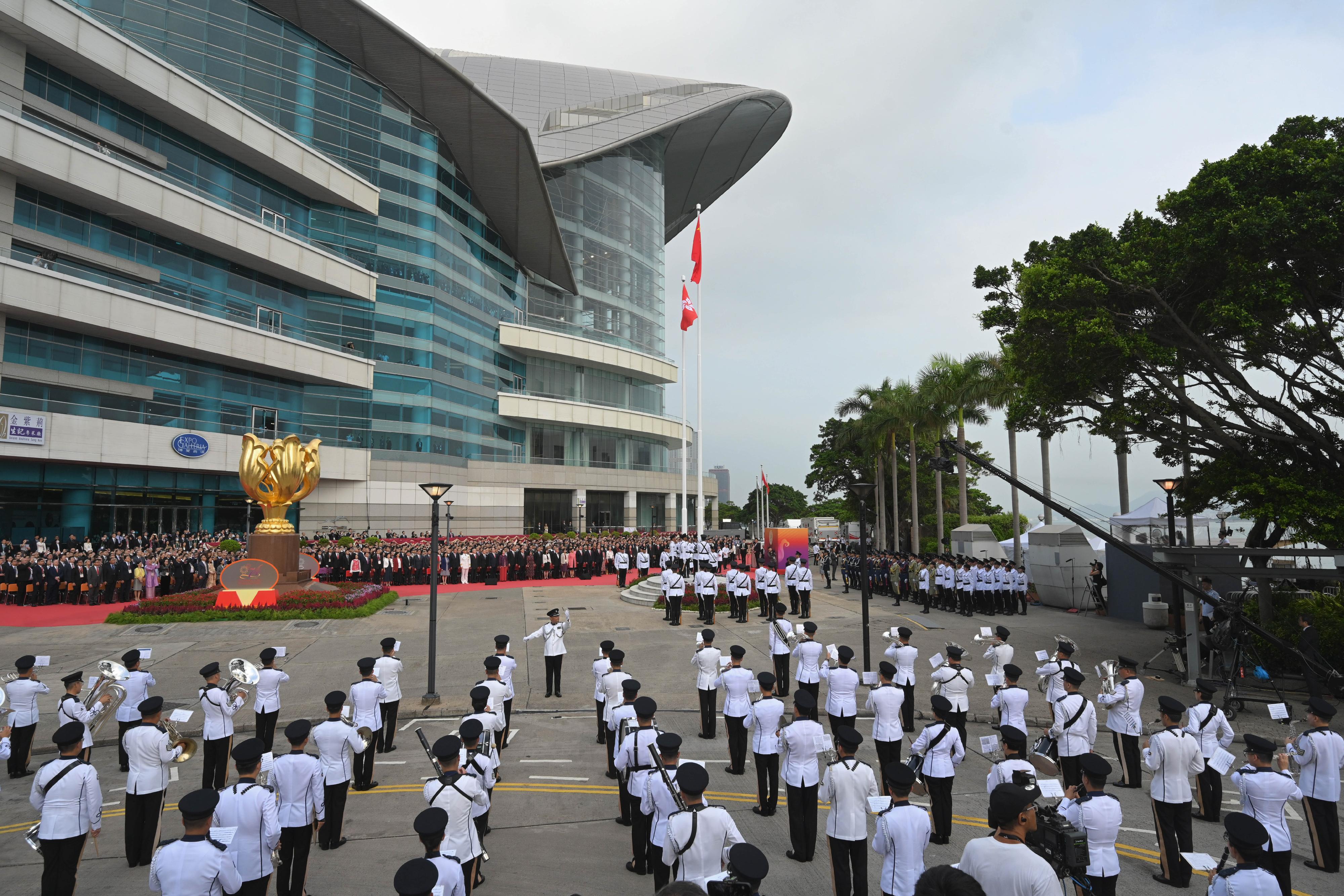 The Chief Executive, Mr John Lee, together with Principal Officials and guests, attends the flag-raising ceremony for the 74th anniversary of the founding of the People's Republic of China at Golden Bauhinia Square in Wan Chai this morning (October 1).