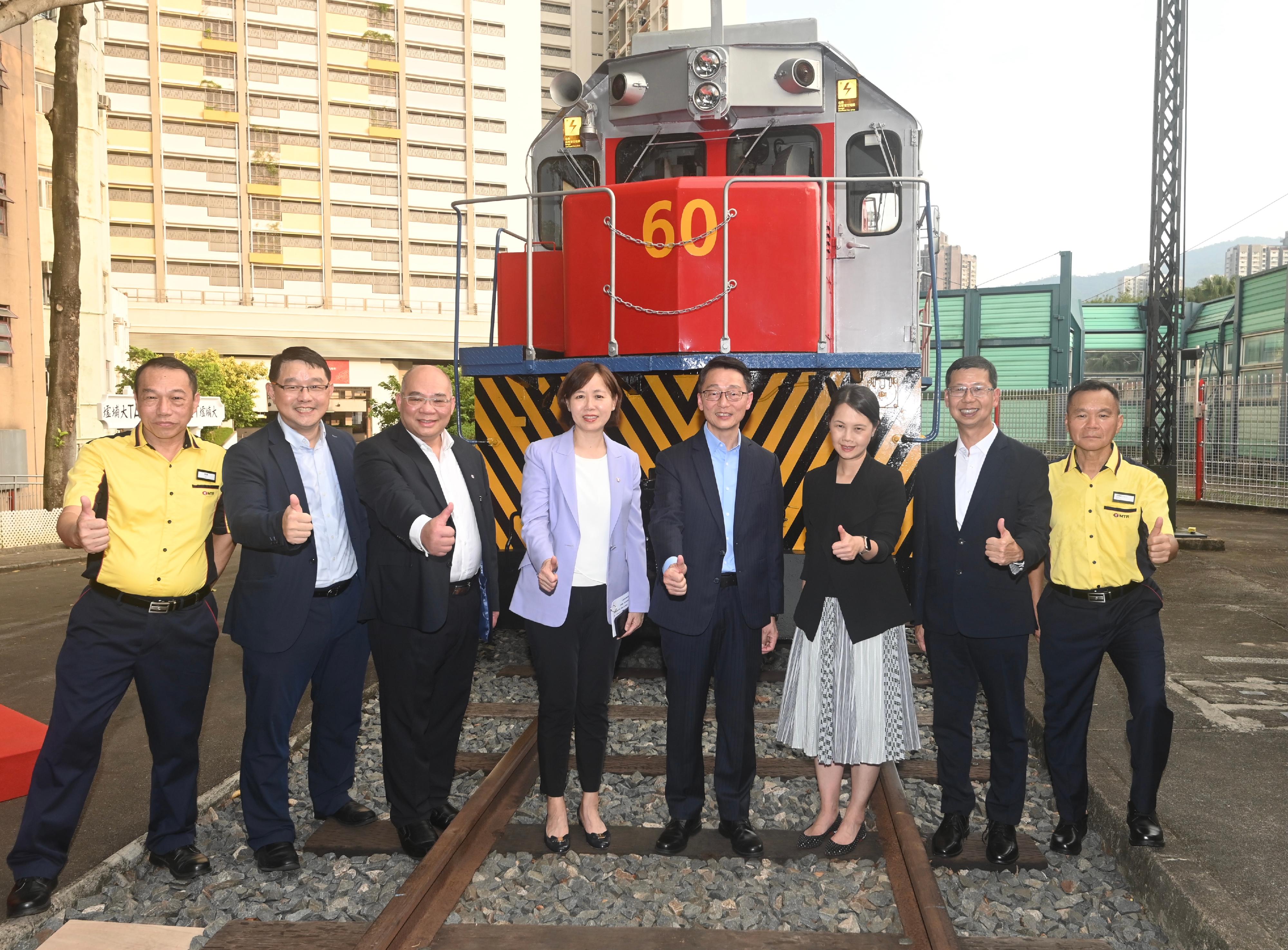 The handover ceremony of Diesel Electric Engine No. 60 (L60) was held today (October 3) at the Hong Kong Railway Museum. Photo shows (from left) a former driver of L60, Mr Cheung Shun-chuen; the Museum Director of the Hong Kong Heritage Museum, Mr Brian Lam; the Operations and Innovation Director of the MTR Corporation Limited (MTRC), Dr Tony Lee; the Managing Director - Hong Kong Transport Services of the MTRC, Ms Jeny Yeung; the Director of Leisure and Cultural Services, Mr Vincent Liu; the Corporate Affairs and Branding Director of the MTRC, Ms Linda Choy; the Company Secretary of the Kowloon-Canton Railway Corporation, Mr C L Wong; and a former driver of L60, Mr Ko Tak-tim, at the ceremony.