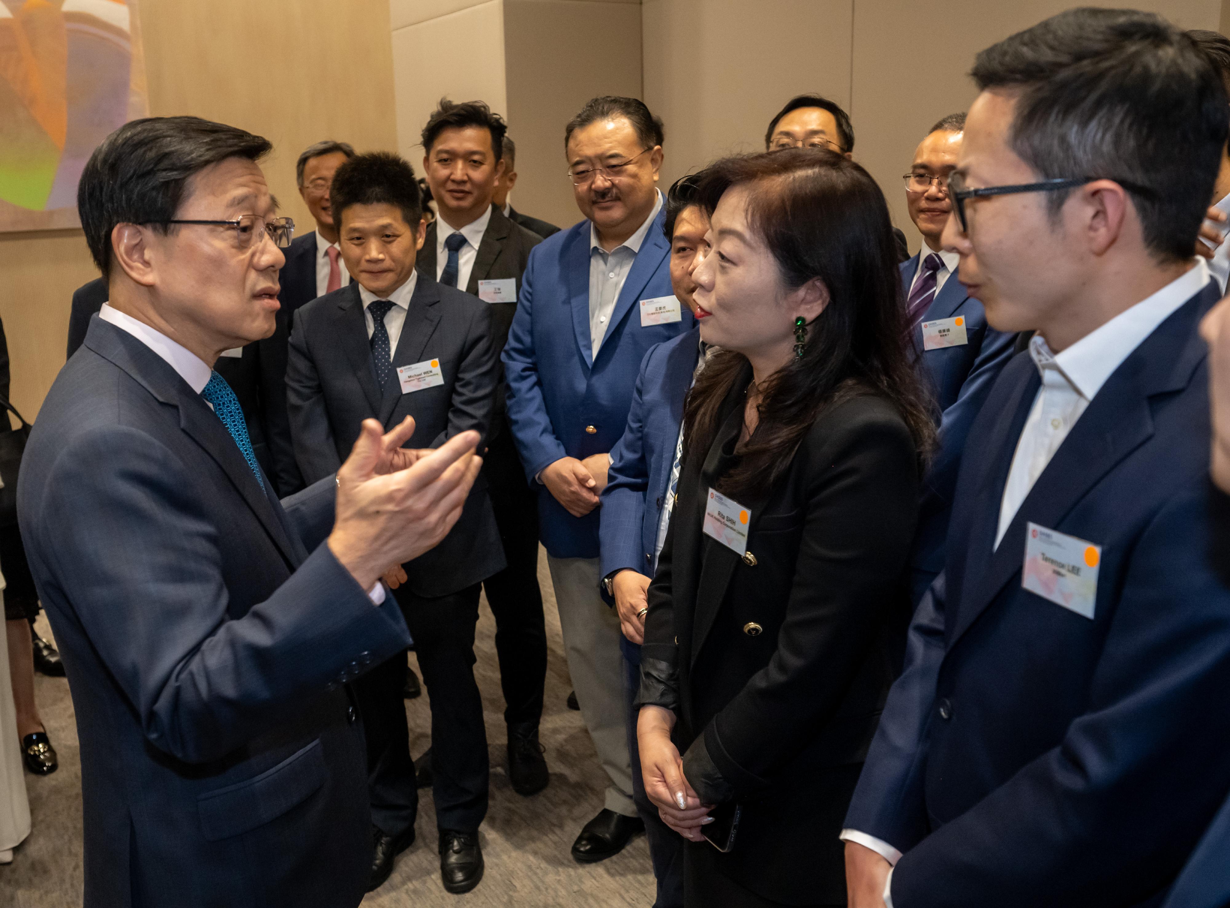 The Office for Attracting Attracting Strategic Enterprises (OASES) held the Launching Ceremony of OASES Partnership. Photo shows the Chief Executive, Mr John Lee (first left), interacting with the representatives of strategic enterprises.