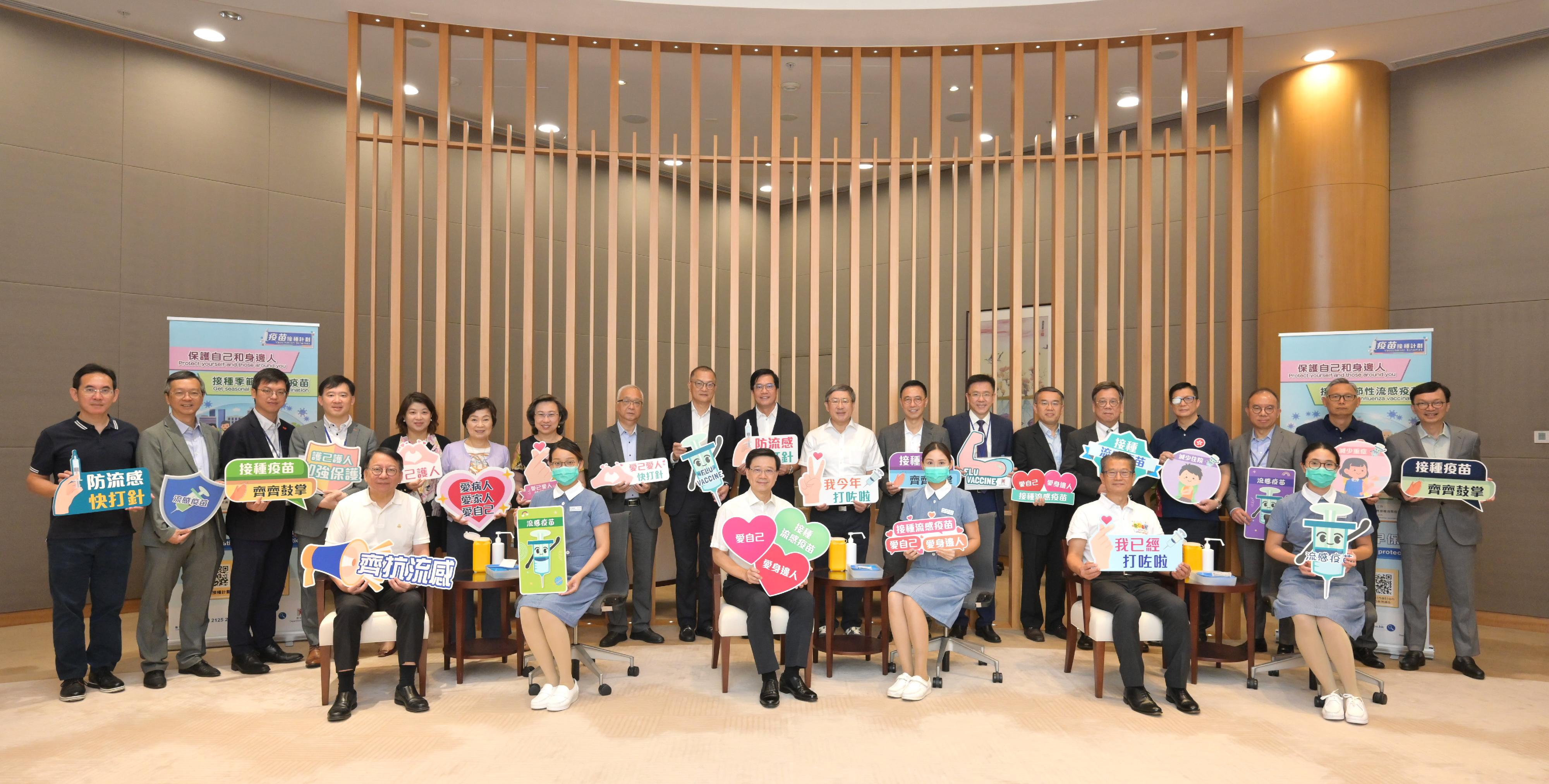 The Chief Executive, Mr John Lee (front row, third left); the Chief Secretary for Administration, Mr Chan Kwok-ki (front row, first left); the Financial Secretary, Mr Paul Chan (front row, second right); the Deputy Chief Secretary for Administration, Mr Cheuk Wing-hing (back row, ninth right); the Deputy Financial Secretary, Mr Michael Wong (back row, tenth right); and a number of Principal Officials and Under Secretaries today (October 5) call on members of the public to get vaccinated early in preparation for the winter influenza season which is around the corner.