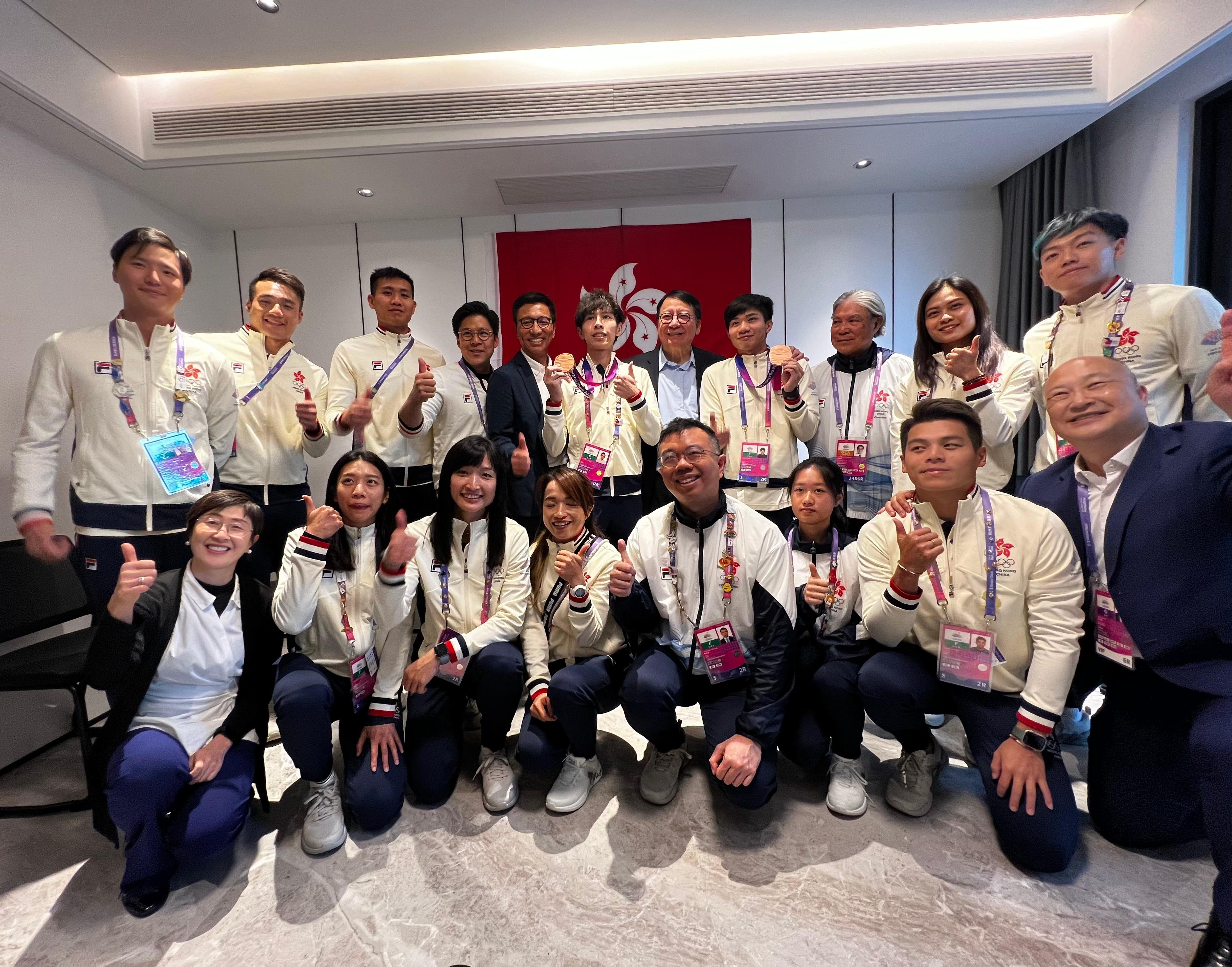 The Chief Secretary for Administration, Mr Chan Kwok-ki, attended the Closing Ceremony of the 19th Asian Games in Hangzhou today (October 8) and beforehand visited the athletes' village of the Asian Games. Photo shows Mr Chan (back row, fifth right); the Commissioner for Sports in the Culture, Sports and Tourism Bureau, Mr Sam Wong (back row, fifth left); the President of the Sports Federation & Olympic Committee of Hong Kong, China, Mr Timothy Fok (back row, third right); and the Chef de Mission of the Hong Kong, China Delegation to the Asian Games, Mr Kenneth Fok (back row, fourth left), with Hong Kong athletes in the village.